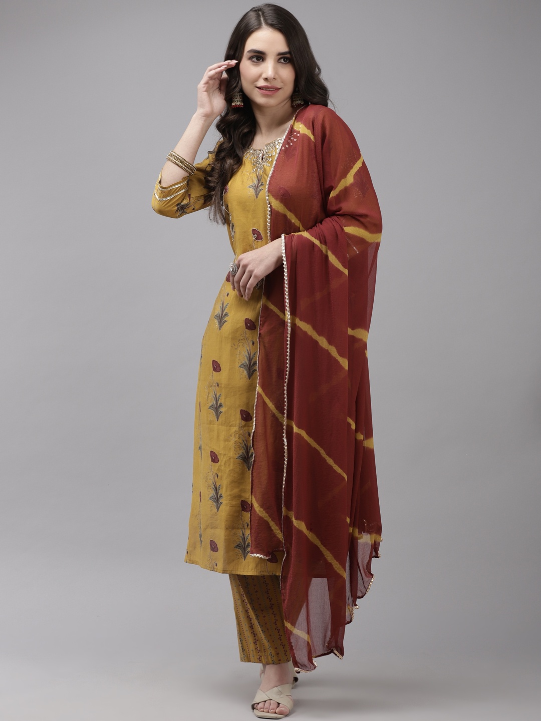 Ishin Women Mustard Yellow Floral Embroidered Regular Kurta with Trousers & With Dupatta
Ishin Women Mustard Yellow Floral Embroidered Regular Kurta with Trousers & With Dupatta