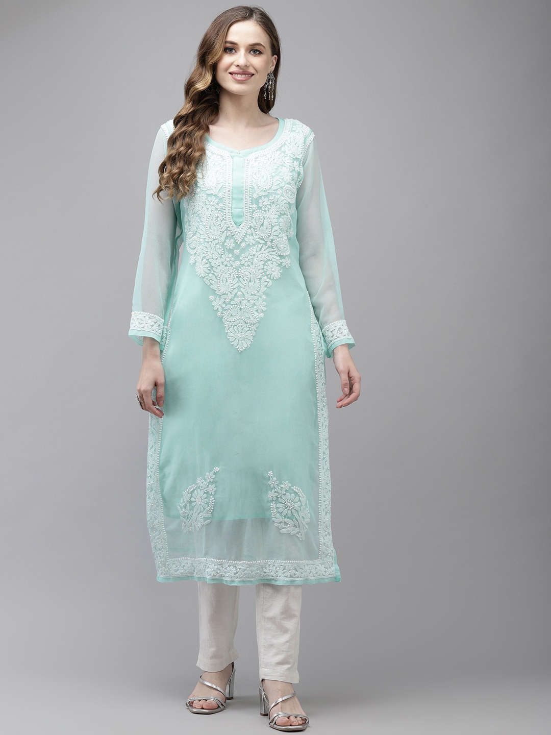 ADA Women Turquoise Blue Chikankari Hand Embroidered Handloom Georgette Handloom Kurta with Slip
ADA Women Turquoise Blue Chikankari Hand Embroidered Handloom Georgette Handloom Kurta with Slip