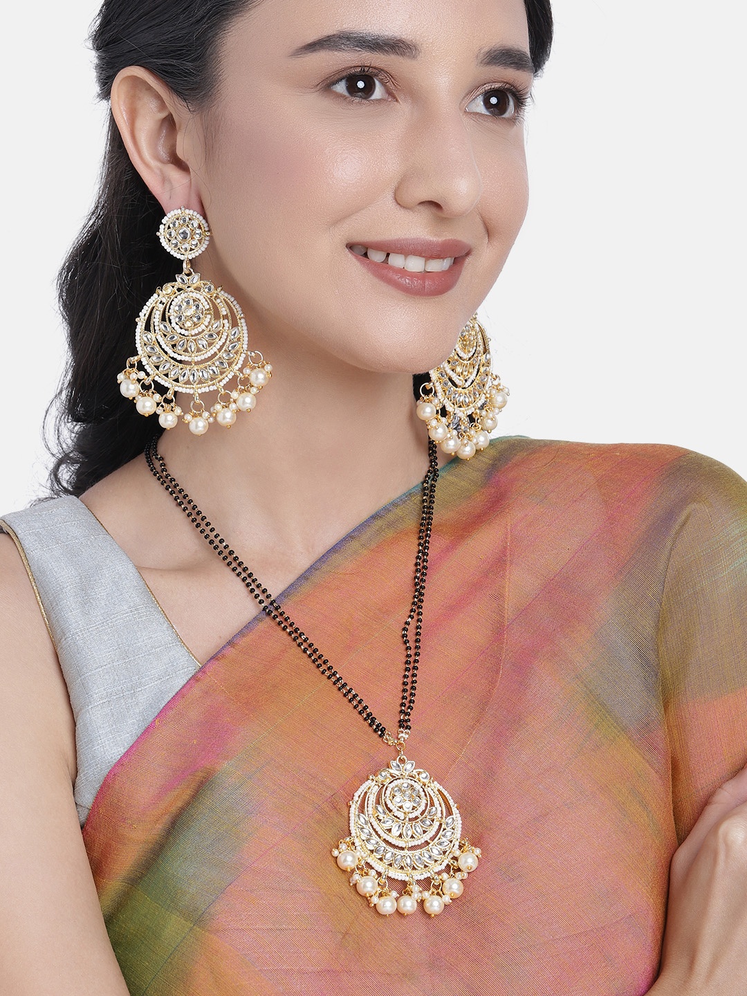 Peora Women Gold-Plated Kundan Studded Long Mangalsutra Beaded Chain & Earrings, White
Peora Women Gold-Plated Kundan Studded Long Mangalsutra Beaded Chain & Earrings, White