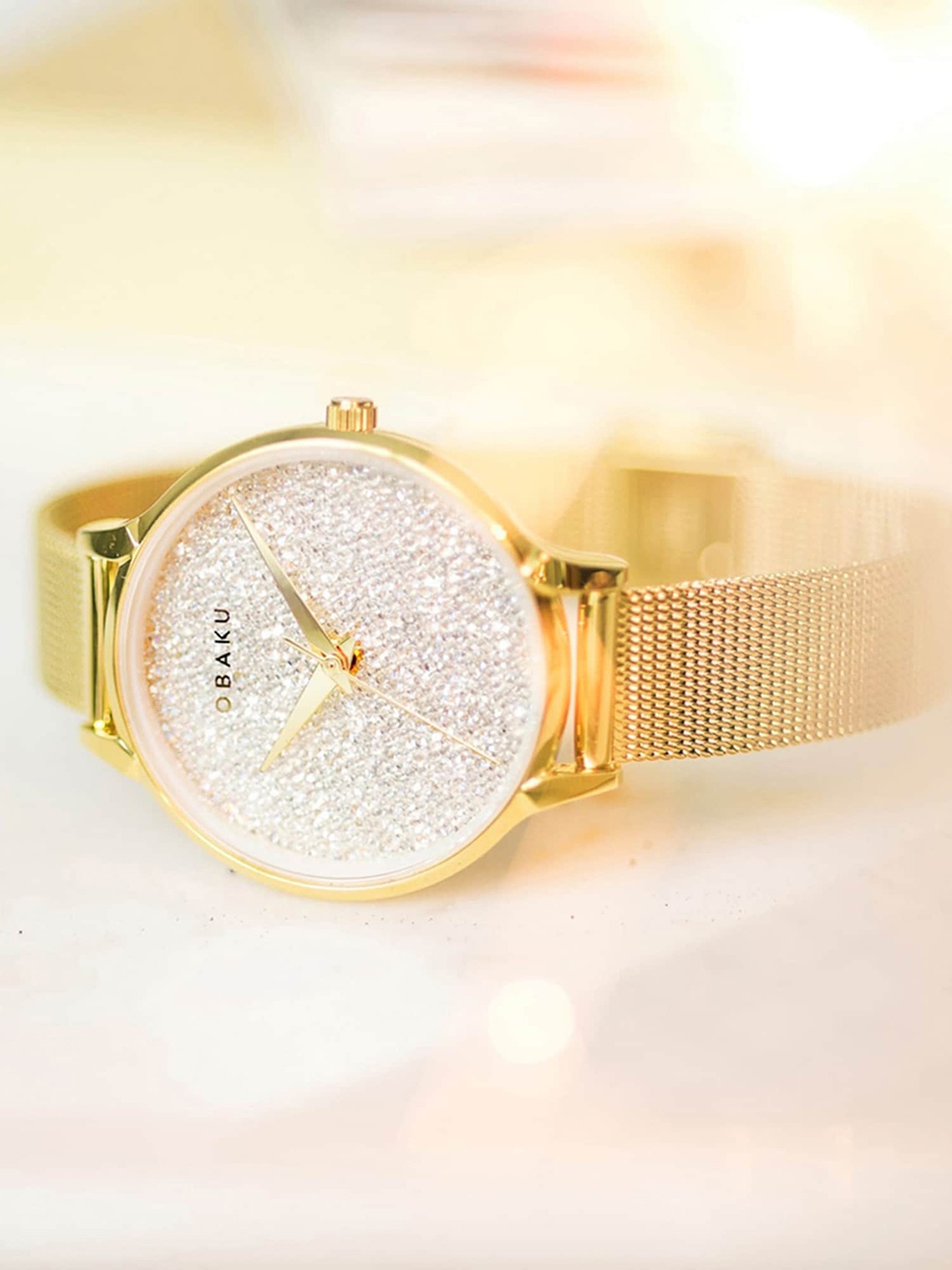 Obaku Women White Brass Embellished Dial & Gold Toned Bracelet Style Strap Analogue Watch
Obaku Women White Brass Embellished Dial & Gold Toned Bracelet Style Strap Analogue Watch