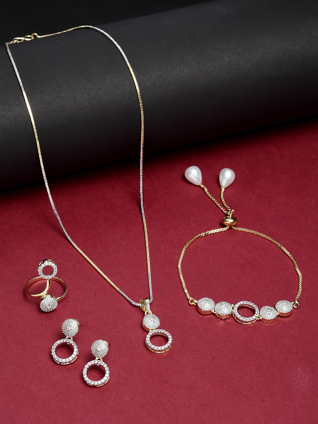 ZENEME White & Gold-Plated Oval Shaped American Diamond Studded Jewellery Set
ZENEME White & Gold-Plated Oval Shaped American Diamond Studded Jewellery Set