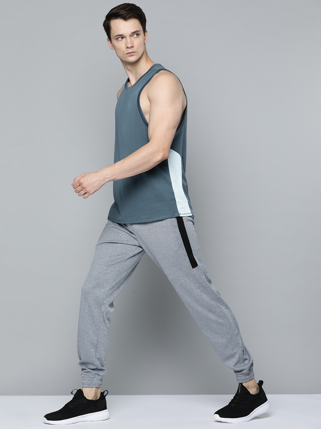 Slazenger Men Grey Melange Solid Running Rapid-Dry Joggers with Side Striped Detail
Slazenger Men Grey Melange Solid Running Rapid-Dry Joggers with Side Striped Detail