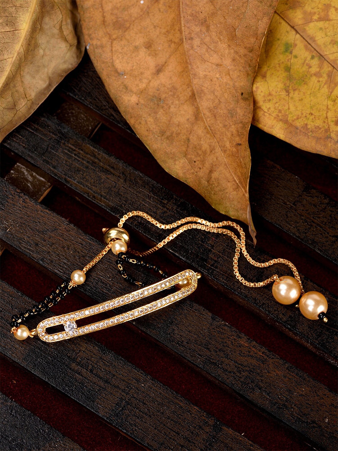 Saraf RS Jewellery Women Gold-Plated Black & White American Diamond Mangalsutra Bracelet
Saraf RS Jewellery Women Gold-Plated Black & White American Diamond Mangalsutra Bracelet
