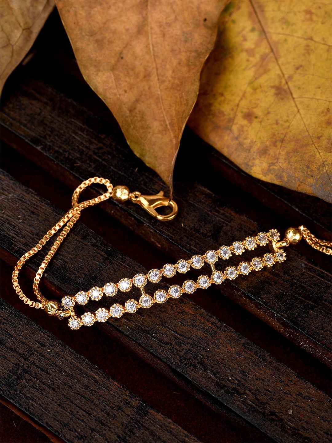 Saraf RS Jewellery Women White & Gold-Toned Brass American Diamond Handcrafted Gold-Plated Link Bracelet
Saraf RS Jewellery Women White & Gold-Toned Brass American Diamond Handcrafted Gold-Plated Link Bracelet