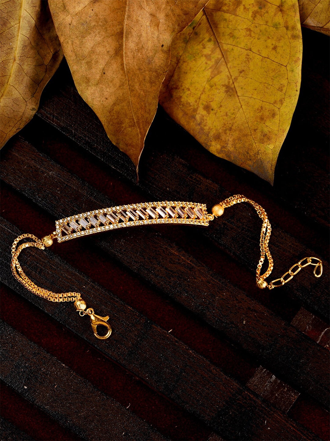 Saraf RS Jewellery Women White & Gold-Toned Brass American Diamond Handcrafted Gold-Plated Link Bracelet
Saraf RS Jewellery Women White & Gold-Toned Brass American Diamond Handcrafted Gold-Plated Link Bracelet