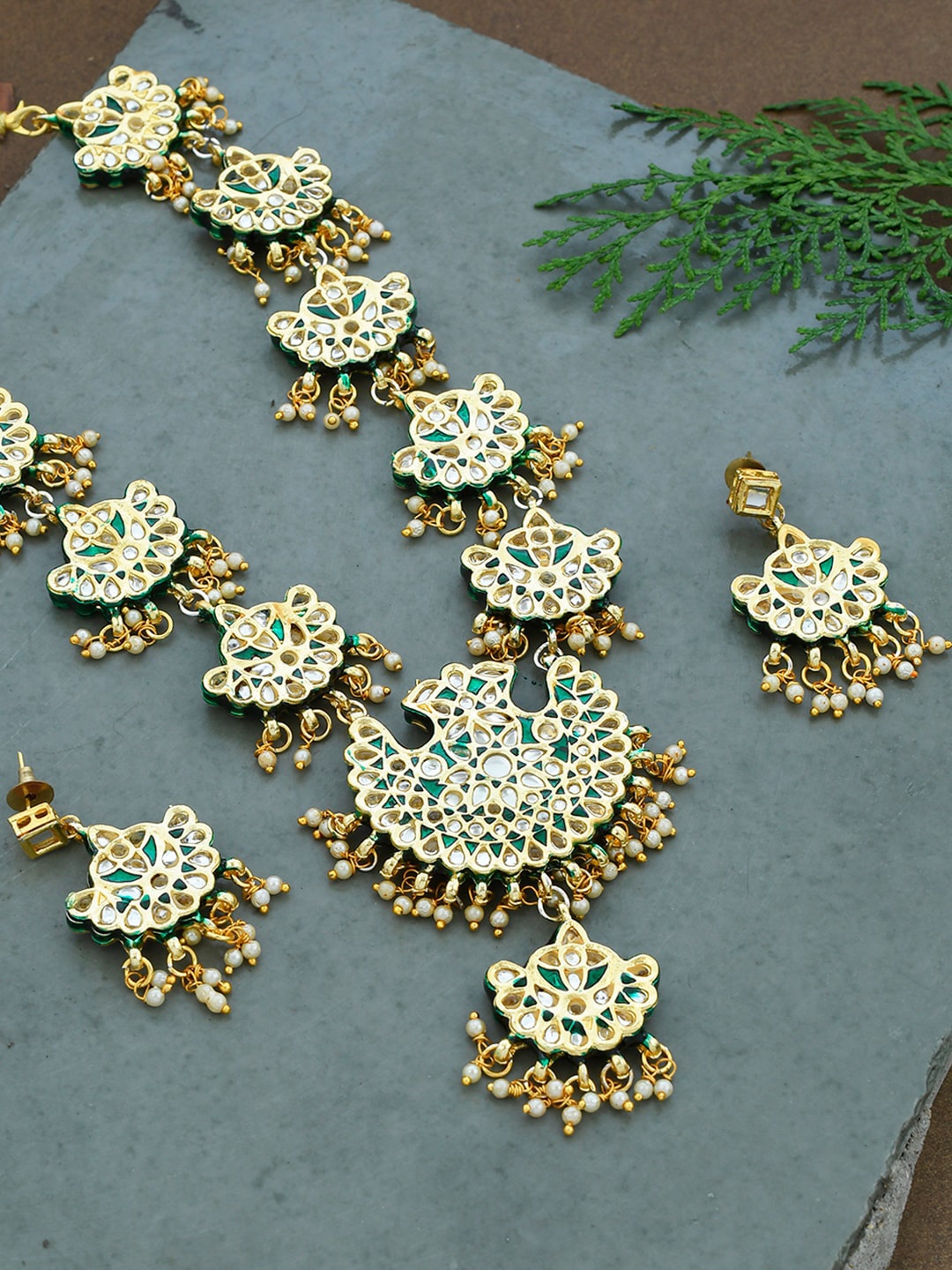 Silvermerc Designs Gold-Plated Green & White Stone Studded & White Beaded Jewellery Set
Silvermerc Designs Gold-Plated Green & White Stone Studded & White Beaded Jewellery Set