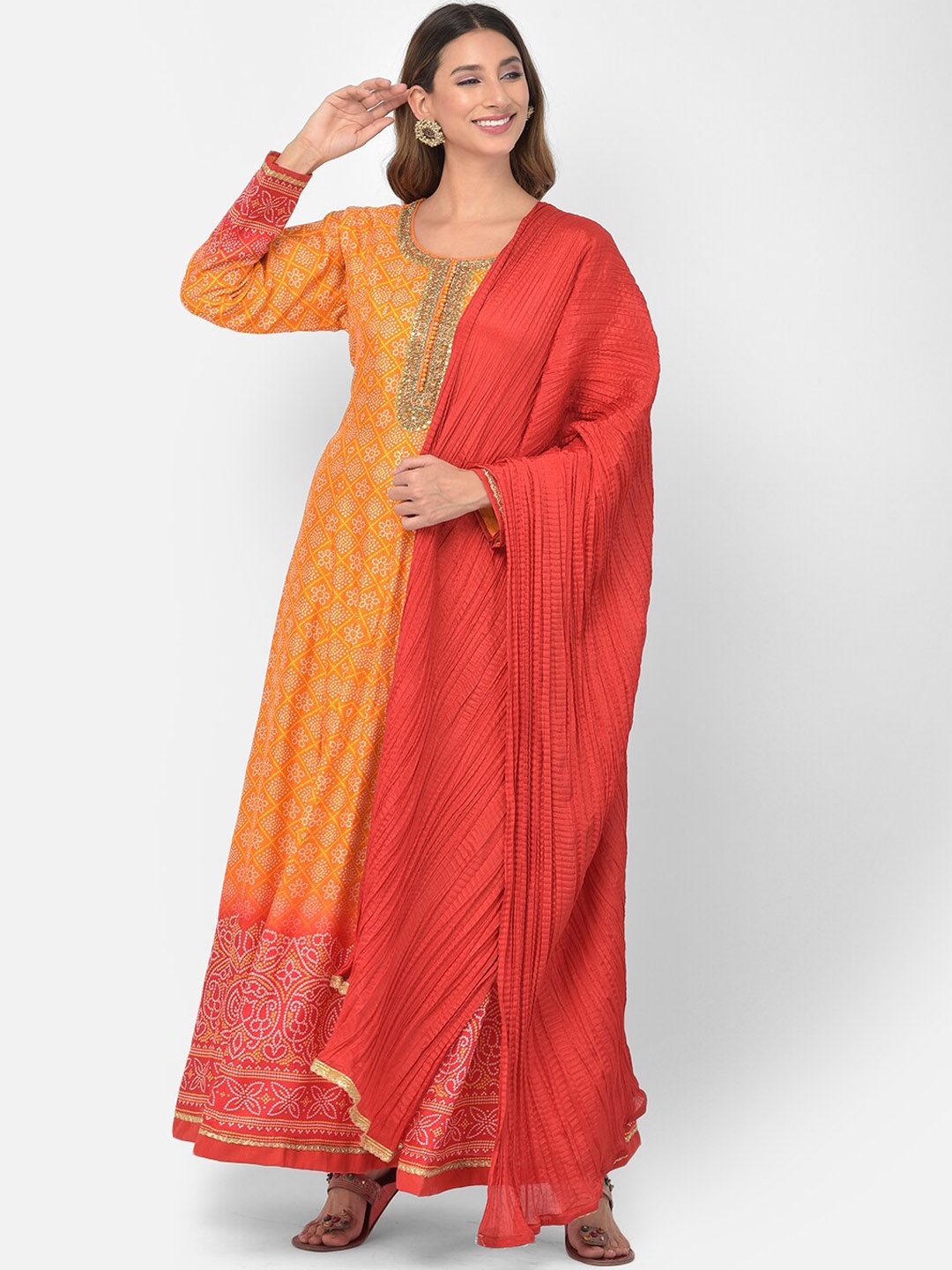Neerus Women Orange Bandhani Printed Regular Zardozi Kurta with Skirt & With Dupatta
Neerus Women Orange Bandhani Printed Regular Zardozi Kurta with Skirt & With Dupatta