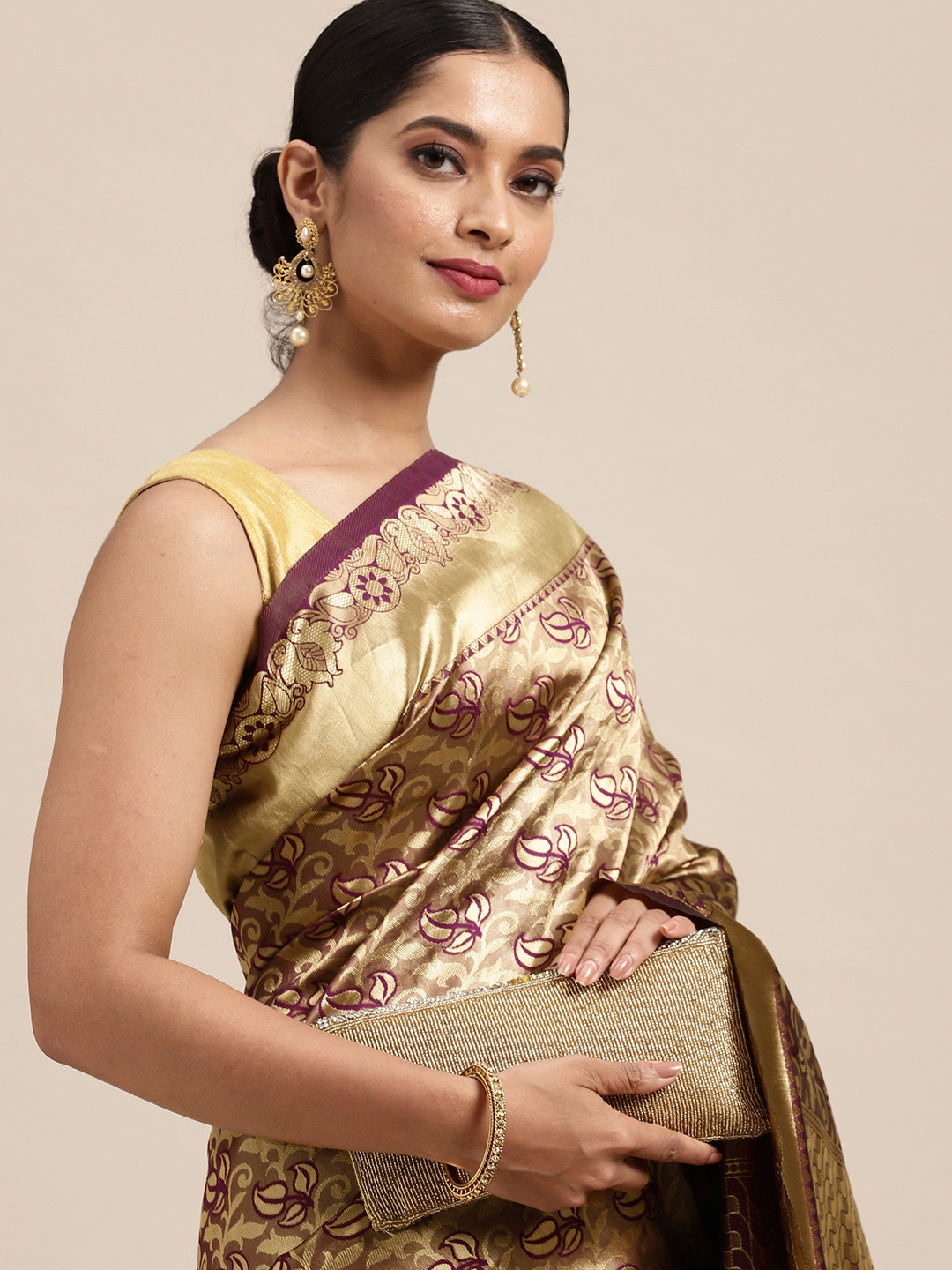 Anouk Purple & Gold-Toned Ethnic Motifs Zari Silk Blend Saree
Anouk Purple & Gold-Toned Ethnic Motifs Zari Silk Blend Saree