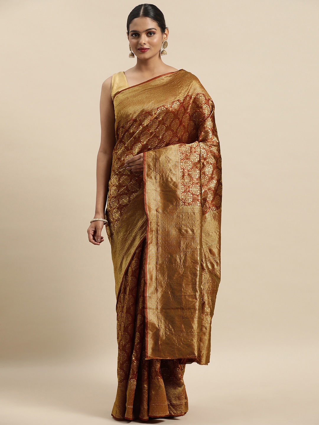 Anouk Maroon & Gold-Toned Ethnic Motifs Zari Heavy Work Cotton Blend Kanjeevaram Saree
Anouk Maroon & Gold-Toned Ethnic Motifs Zari Heavy Work Cotton Blend Kanjeevaram Saree