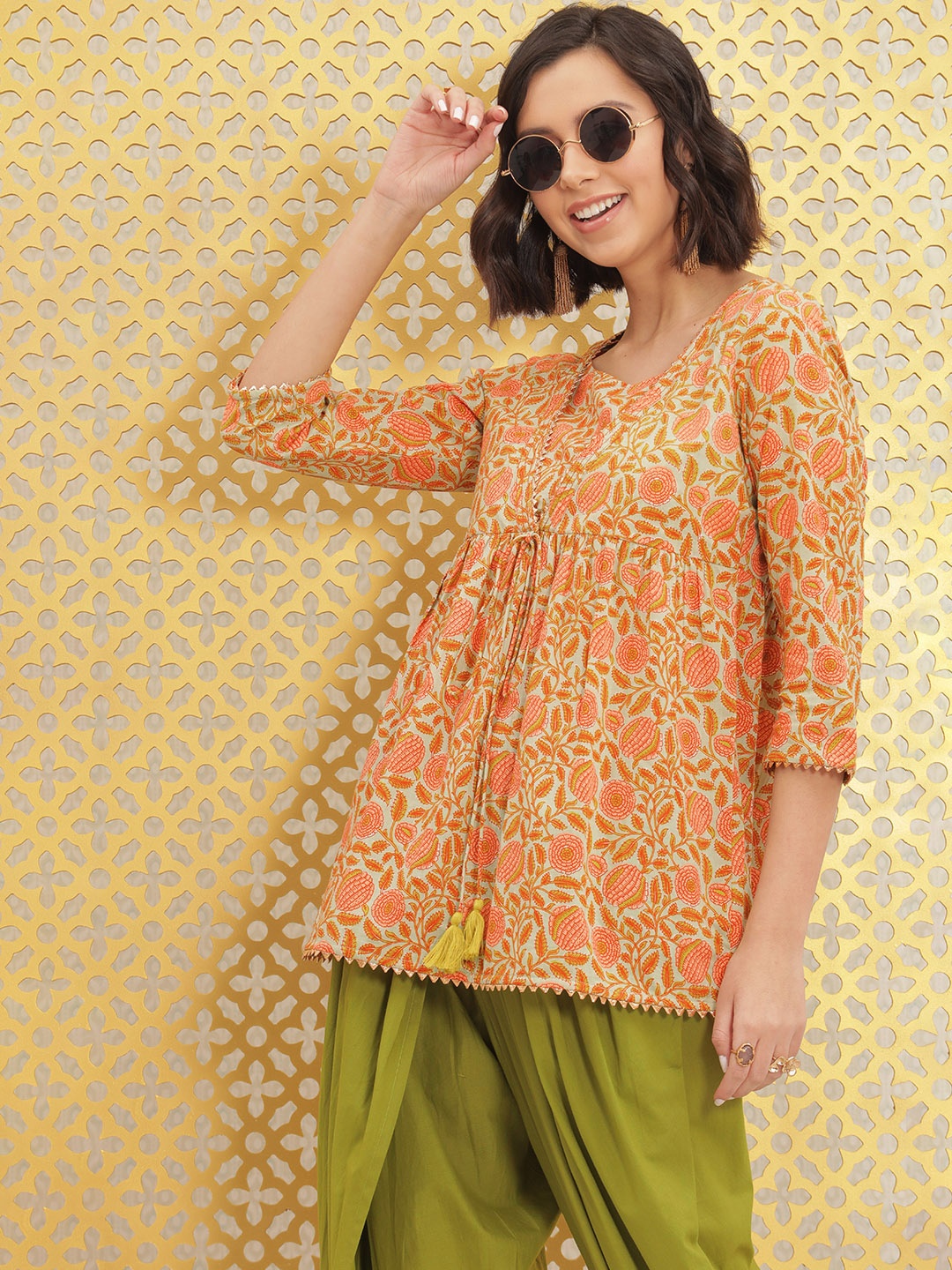 Ode by House of Pataudi Women Orange Printed Pure Cotton Rozana Kurti with Dhoti Pants
Ode by House of Pataudi Women Orange Printed Pure Cotton Rozana Kurti with Dhoti Pants