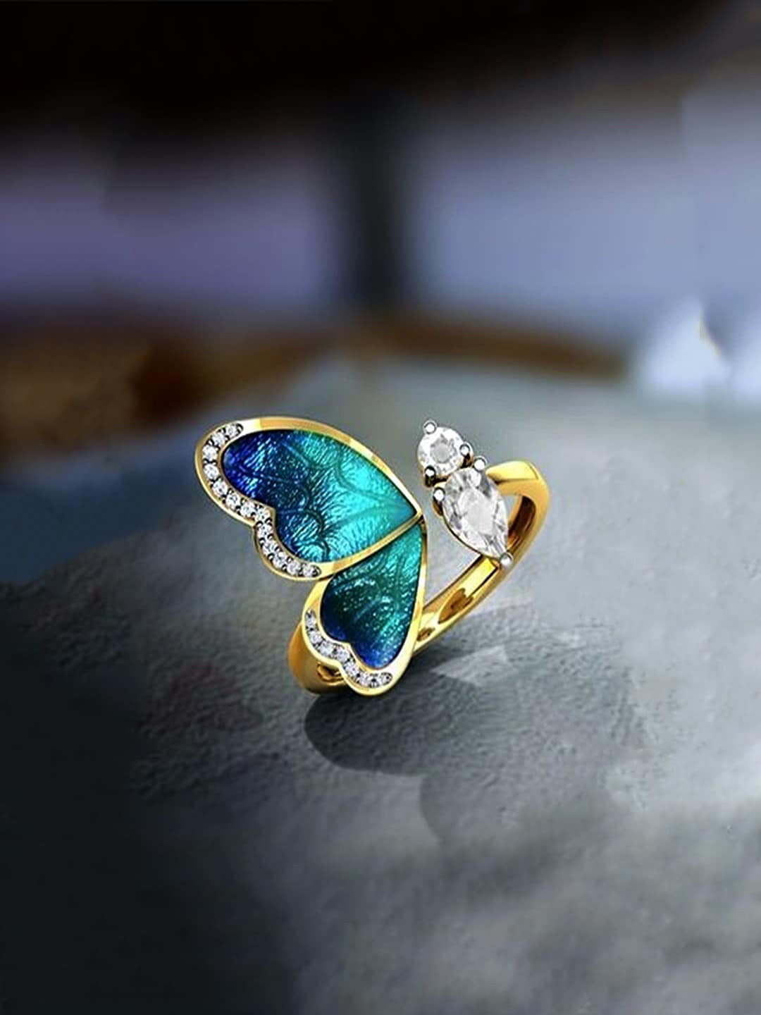 Yellow Chimes Woman Gold-Plated Blue & White Butterfly Crystal Studded Finger Ring 
Yellow Chimes Woman Gold-Plated Blue & White Butterfly Crystal Studded Finger Ring