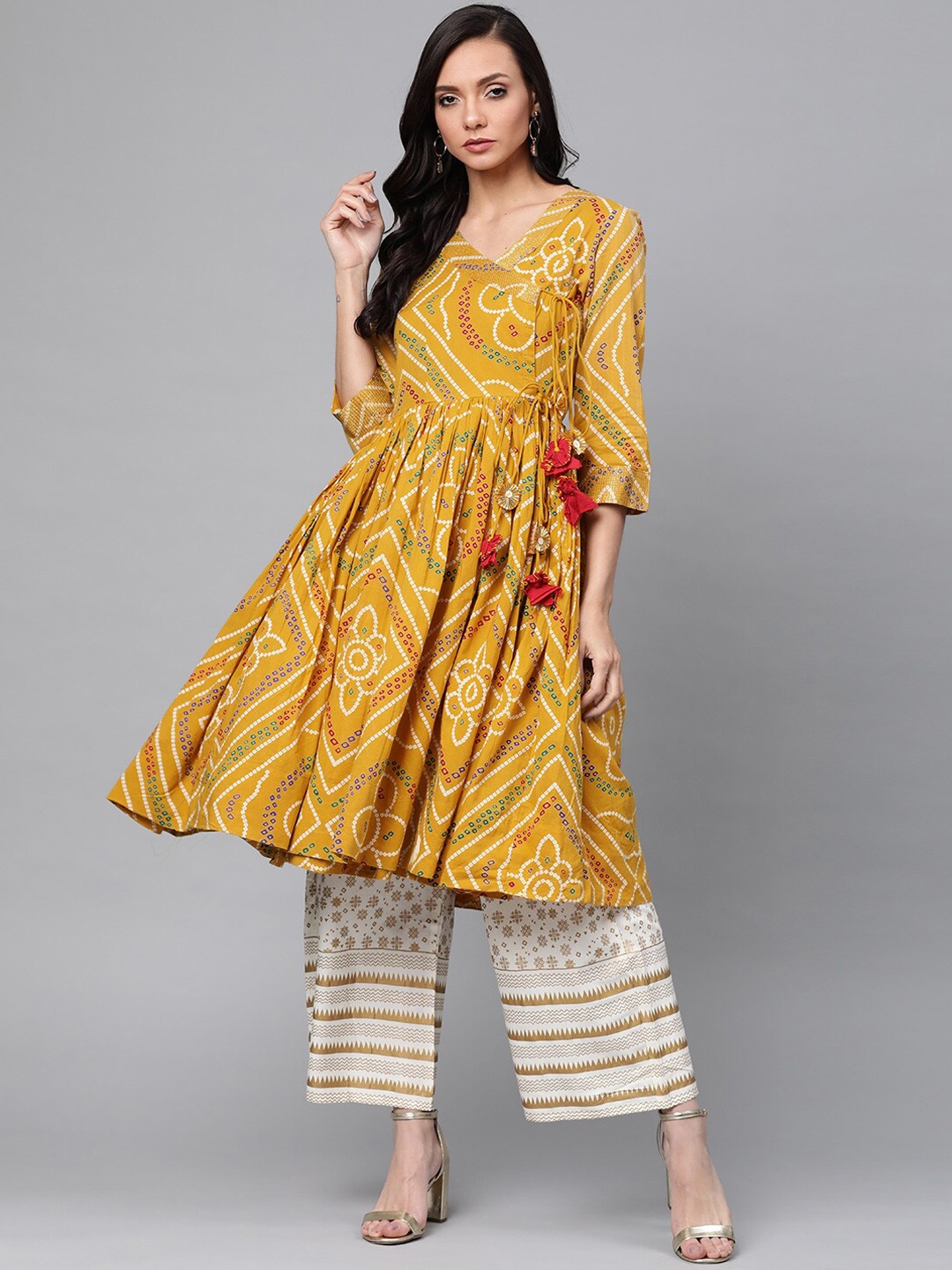 Anubhutee Women Mustard Yellow Printed Pleated Pure Cotton Kurta with Palazzos
Anubhutee Women Mustard Yellow Printed Pleated Pure Cotton Kurta with Palazzos