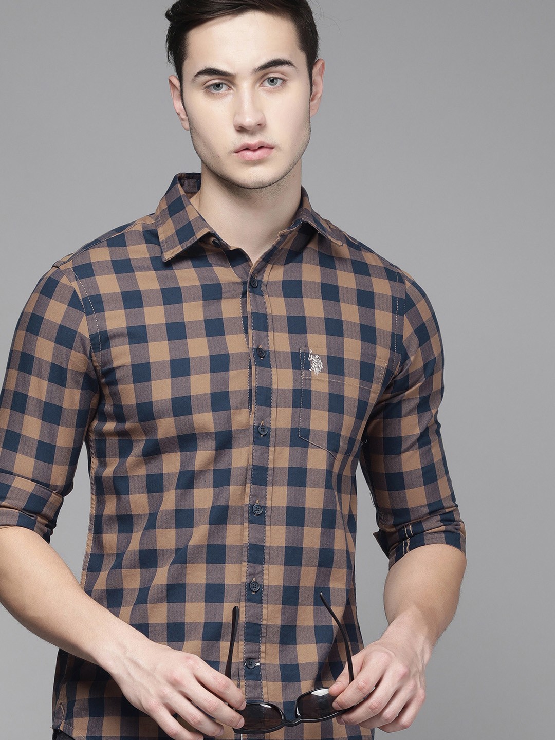 U S Polo Assn Men Khaki And Blue Tailored Fit Buffalo Checked Pure Cotton Casual Shirt
U S Polo Assn Men Khaki And Blue Tailored Fit Buffalo Checked Pure Cotton Casual Shirt
