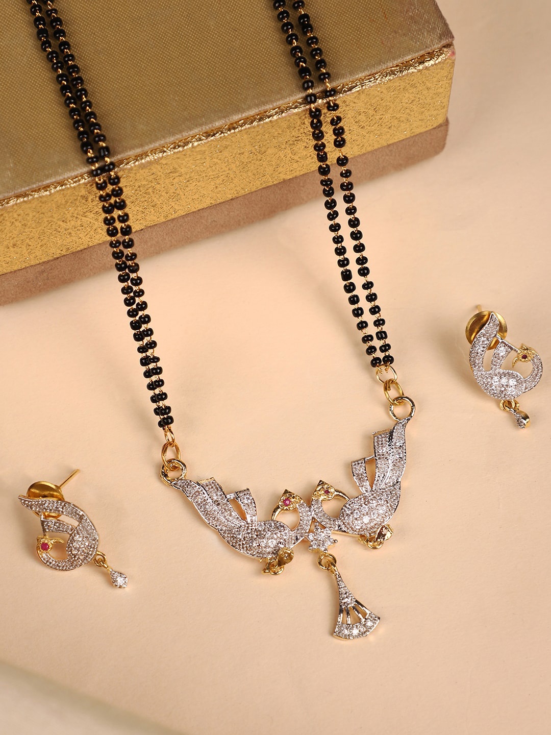 ANIKAS CREATION Gold-Plated Black & White Stone-Studded & Beaded Mangalsutra With Earrings
ANIKAS CREATION Gold-Plated Black & White Stone-Studded & Beaded Mangalsutra With Earrings