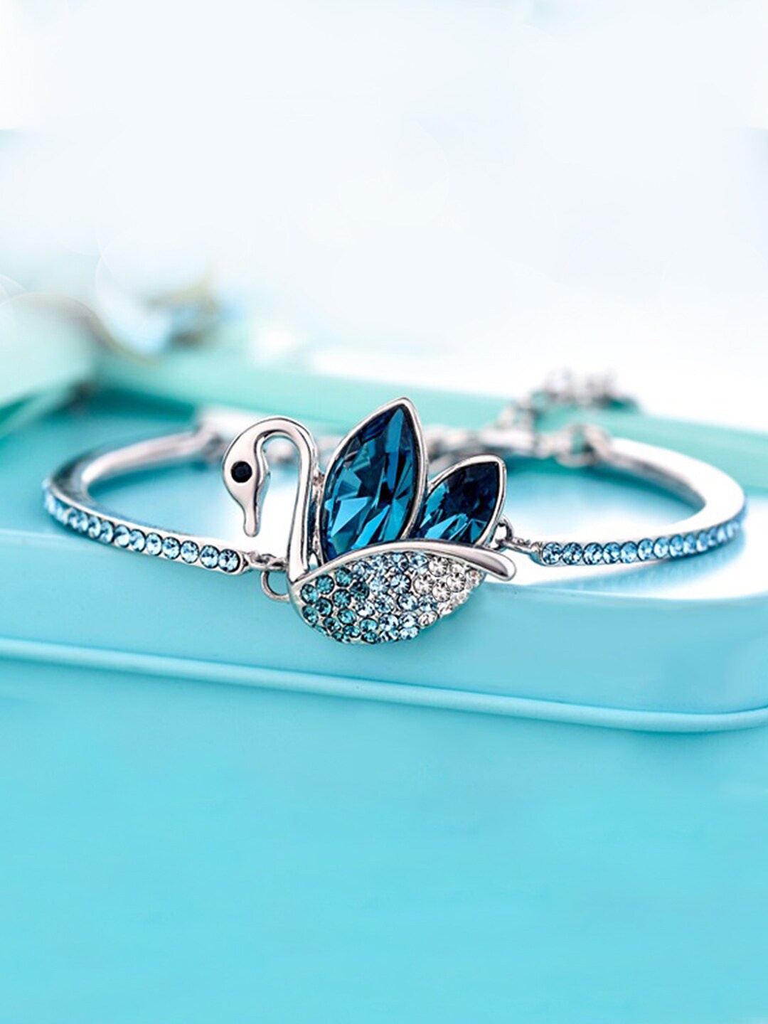 Yellow Chimes Women Silver-Toned & Blue Crystals Swan Love Rhodium-Plated Bracelet
Yellow Chimes Women Silver-Toned & Blue Crystals Swan Love Rhodium-Plated Bracelet