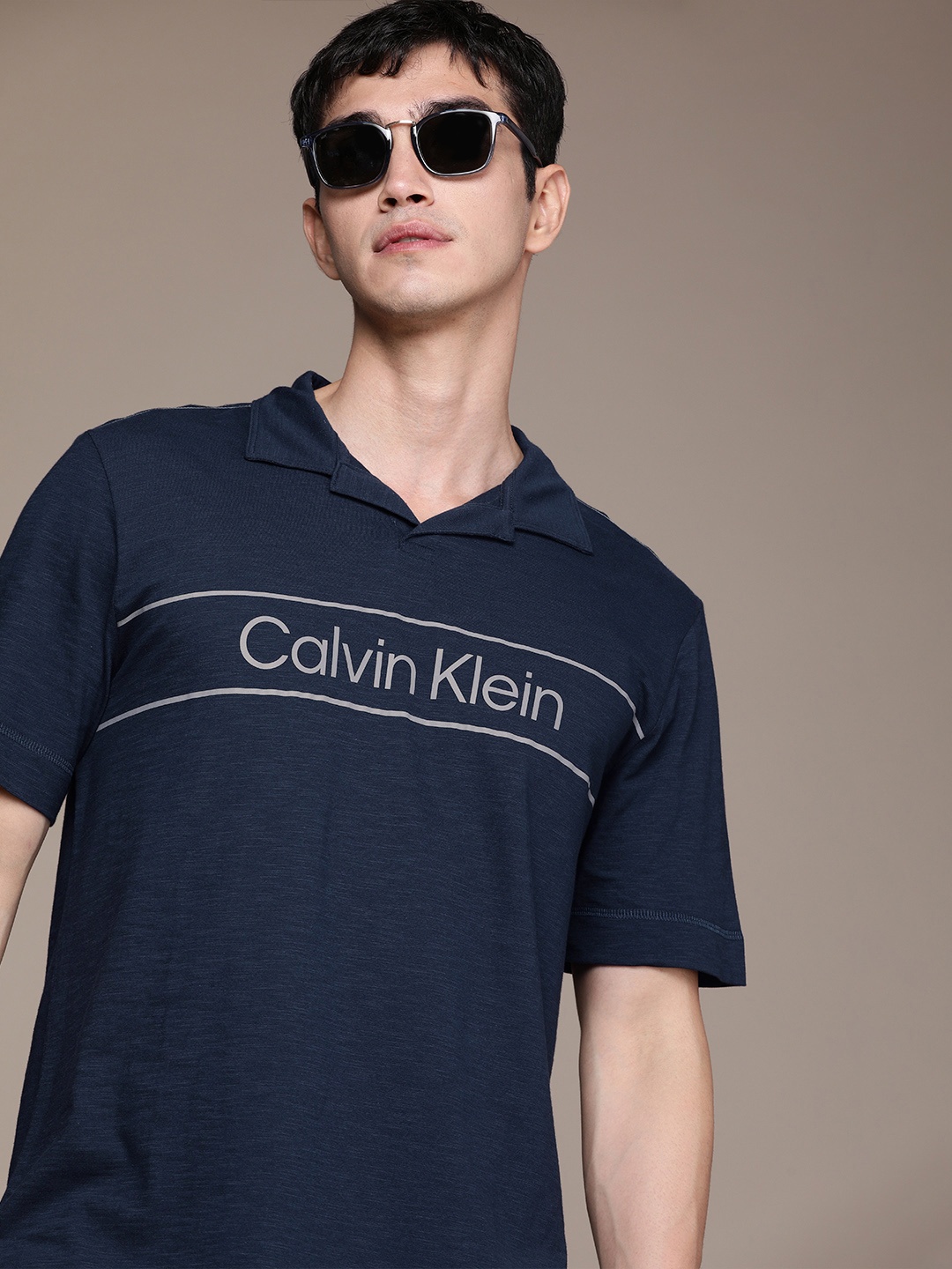 Calvin Klein Jeans Men Navy Blue Brand Logo Printed Polo Collar Pure Cotton T-shirt
Calvin Klein Jeans Men Navy Blue Brand Logo Printed Polo Collar Pure Cotton T-shirt