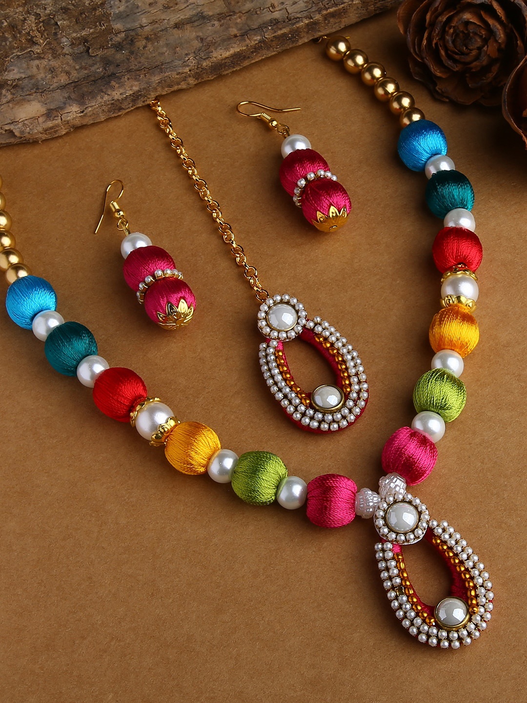 AKSHARA Gold-Plated & Red Stones-Studded & Beaded Wooden Balls Silk Thread Jewellery Set
AKSHARA Gold-Plated & Red Stones-Studded & Beaded Wooden Balls Silk Thread Jewellery Set