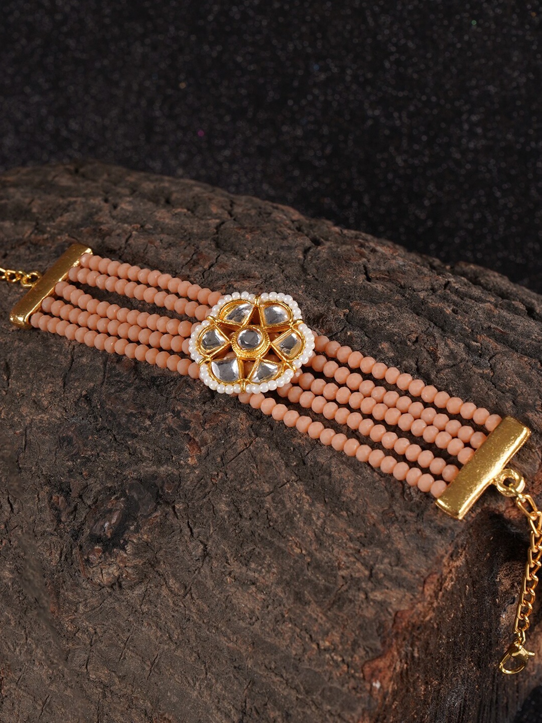 Shoshaa Women Gold-Toned & Peach-Coloured Brass Handcrafted Kundan Wraparound Bracelet
Shoshaa Women Gold-Toned & Peach-Coloured Brass Handcrafted Kundan Wraparound Bracelet