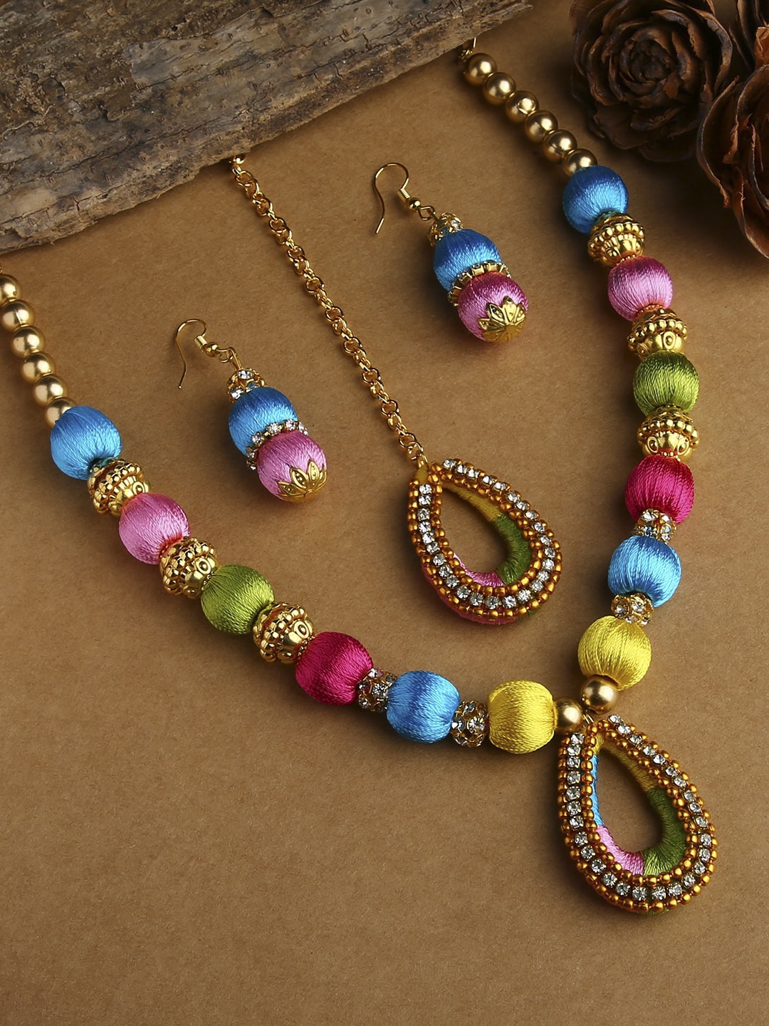 AKSHARA Gold-Plated Multi Color Stone-Studded & Beaded Wooden Balls Silk Thread Jewellery Set
AKSHARA Gold-Plated Multi Color Stone-Studded & Beaded Wooden Balls Silk Thread Jewellery Set