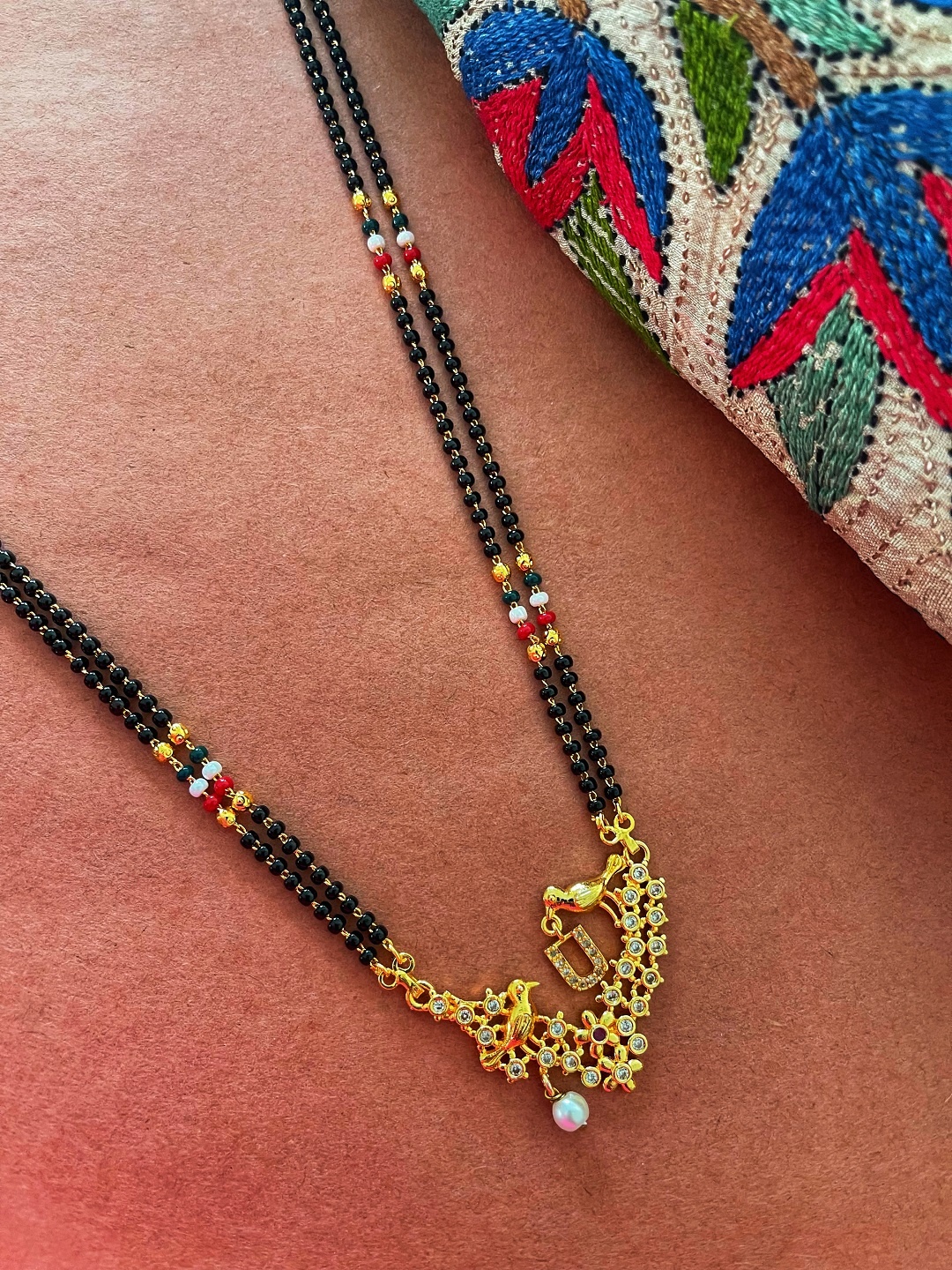 Digital Dress Room Gold-Plated Black & White Beaded & Stone-Studded U-Alphabet Mangalsutra
Digital Dress Room Gold-Plated Black & White Beaded & Stone-Studded U-Alphabet Mangalsutra