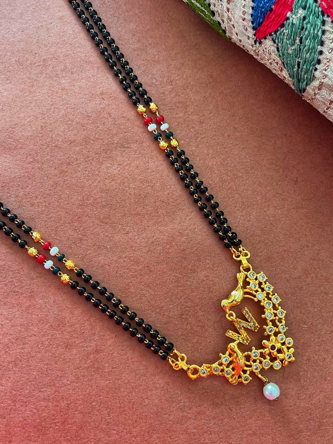 Digital Dress Room Gold-Plated Black & White Beaded & Stone-Studded W-Alphabet Mangalsutra
Digital Dress Room Gold-Plated Black & White Beaded & Stone-Studded W-Alphabet Mangalsutra