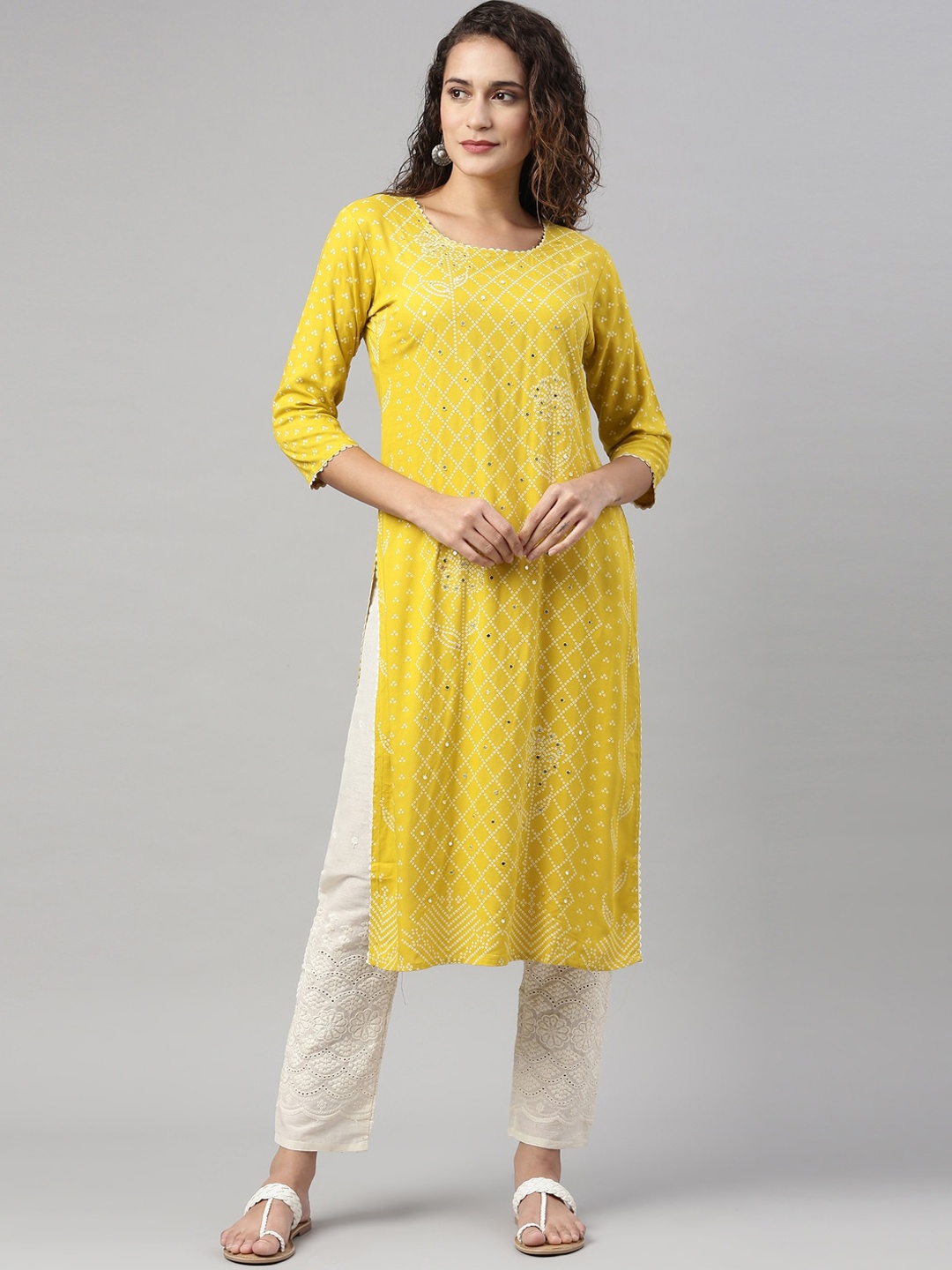 Neerus Women Mustard Yellow Ethnic Motifs Printed Panelled Mirror Work Kurta with Trousers
Neerus Women Mustard Yellow Ethnic Motifs Printed Panelled Mirror Work Kurta with Trousers