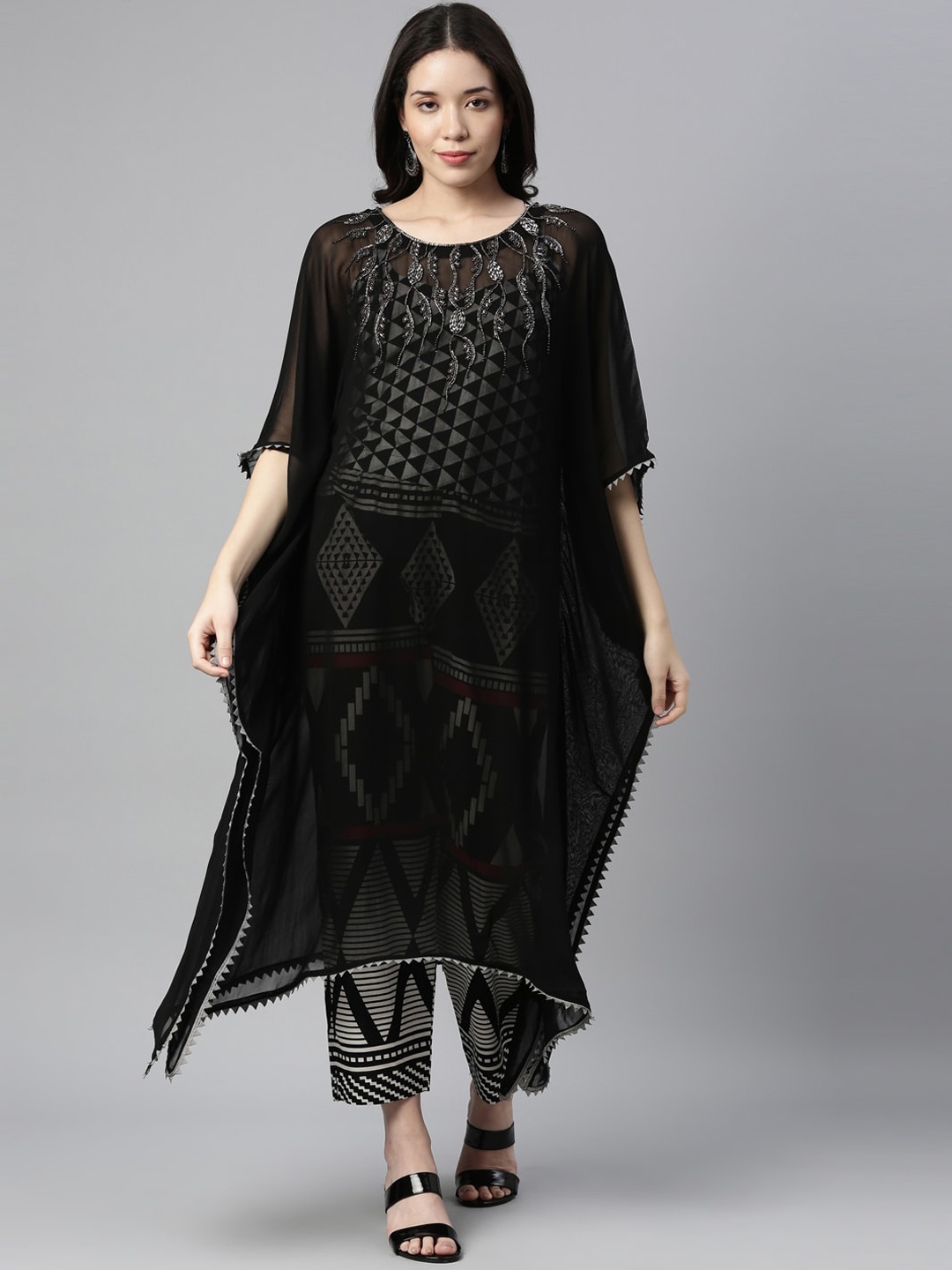 Neerus Women Black Ethnic Motifs Panelled Beads and Stones Kurta with Trousers & With Dupatta
Neerus Women Black Ethnic Motifs Panelled Beads and Stones Kurta with Trousers & With Dupatta