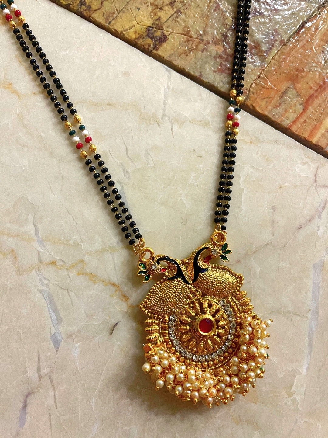 Digital Dress Room Gold-Plated Black & White Stone-Studded & Pearl Beaded Mangalsutra
Digital Dress Room Gold-Plated Black & White Stone-Studded & Pearl Beaded Mangalsutra
