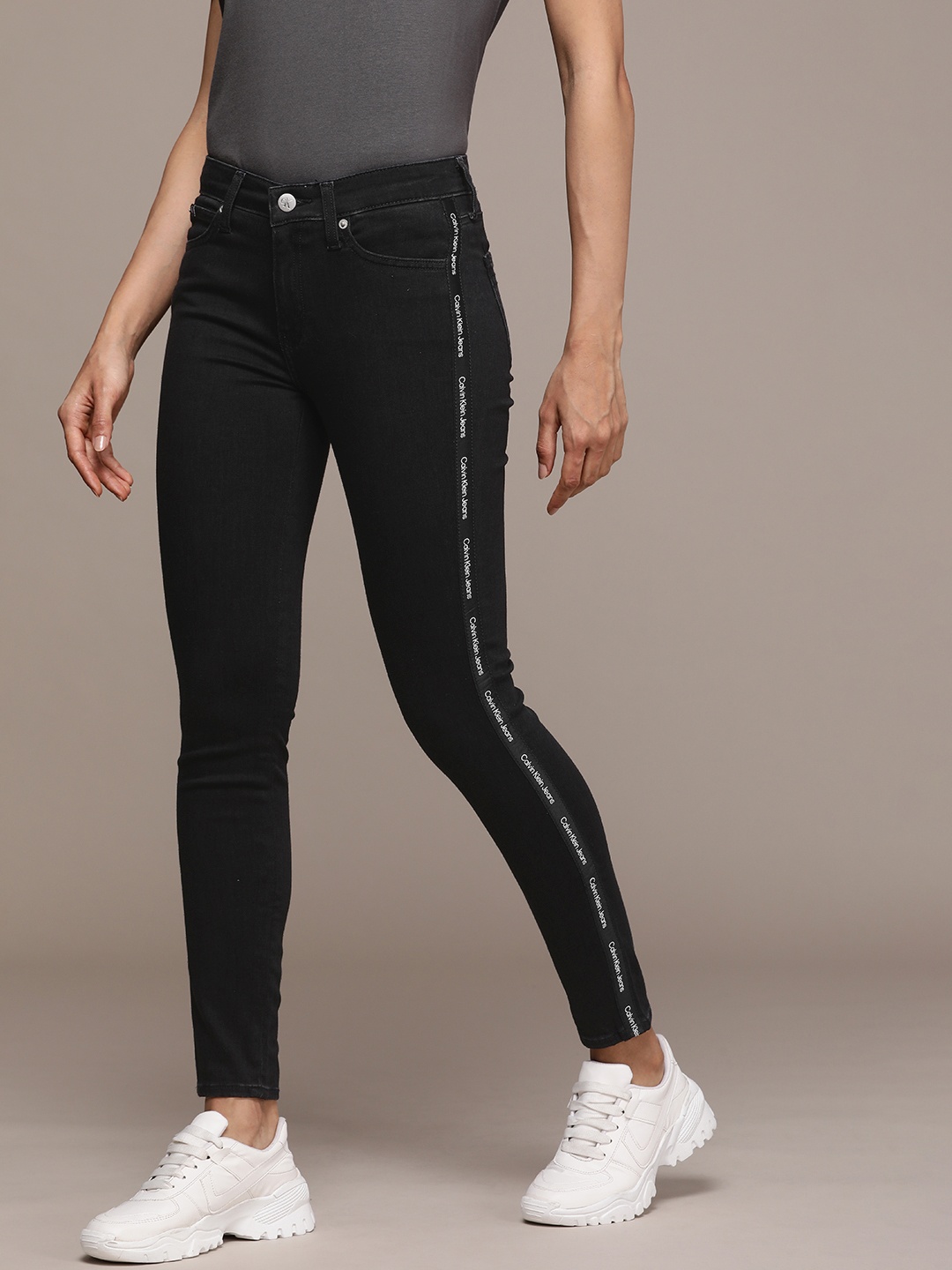 Calvin Klein Jeans Women Mid Rise Skinny Fit Stretchable Jeans With Brand Logo Tape Detail, Black
Calvin Klein Jeans Women Mid Rise Skinny Fit Stretchable Jeans With Brand Logo Tape Detail, Black