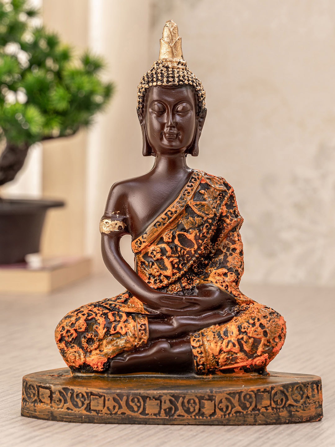 TIED RIBBONS Orange & Brown Decorative Meditating Lord Buddha Idol Figurine Showpiece
TIED RIBBONS Orange & Brown Decorative Meditating Lord Buddha Idol Figurine Showpiece