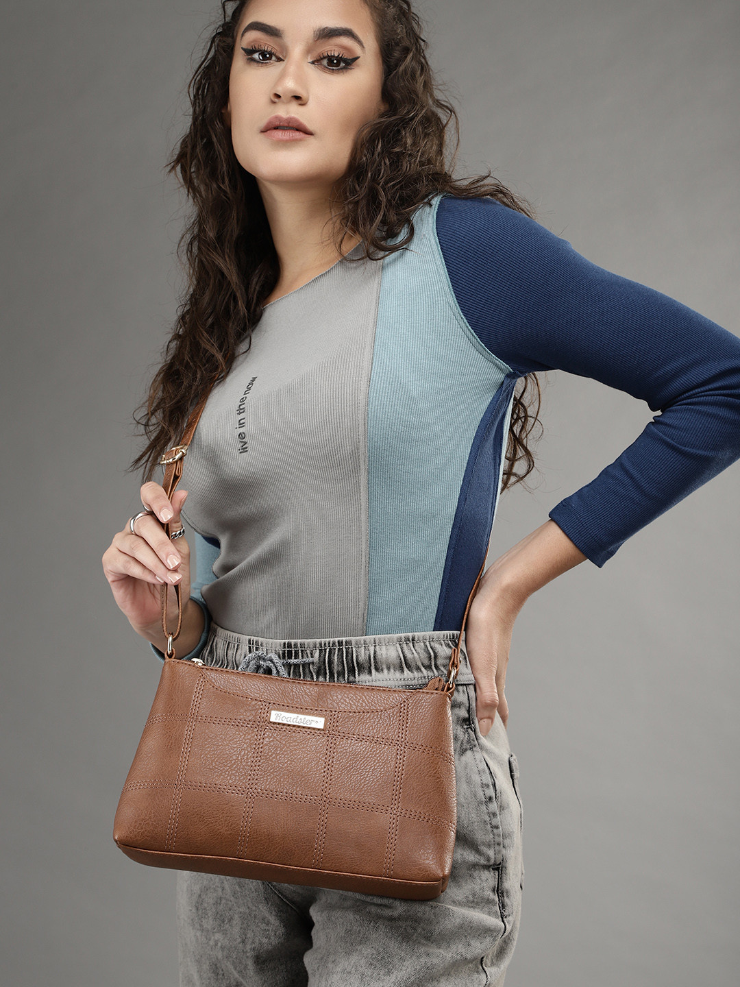 Roadster Women Tan Textured Structured Sling Bag
Roadster Women Tan Textured Structured Sling Bag