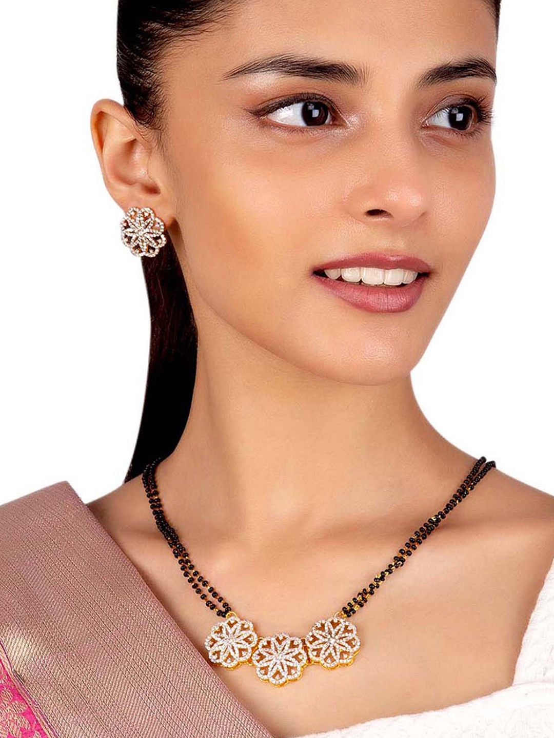 Voylla Women Black Gold-Plated American Diamond CZ Beaded Mangalsutra With Earrings
Voylla Women Black Gold-Plated American Diamond CZ Beaded Mangalsutra With Earrings
