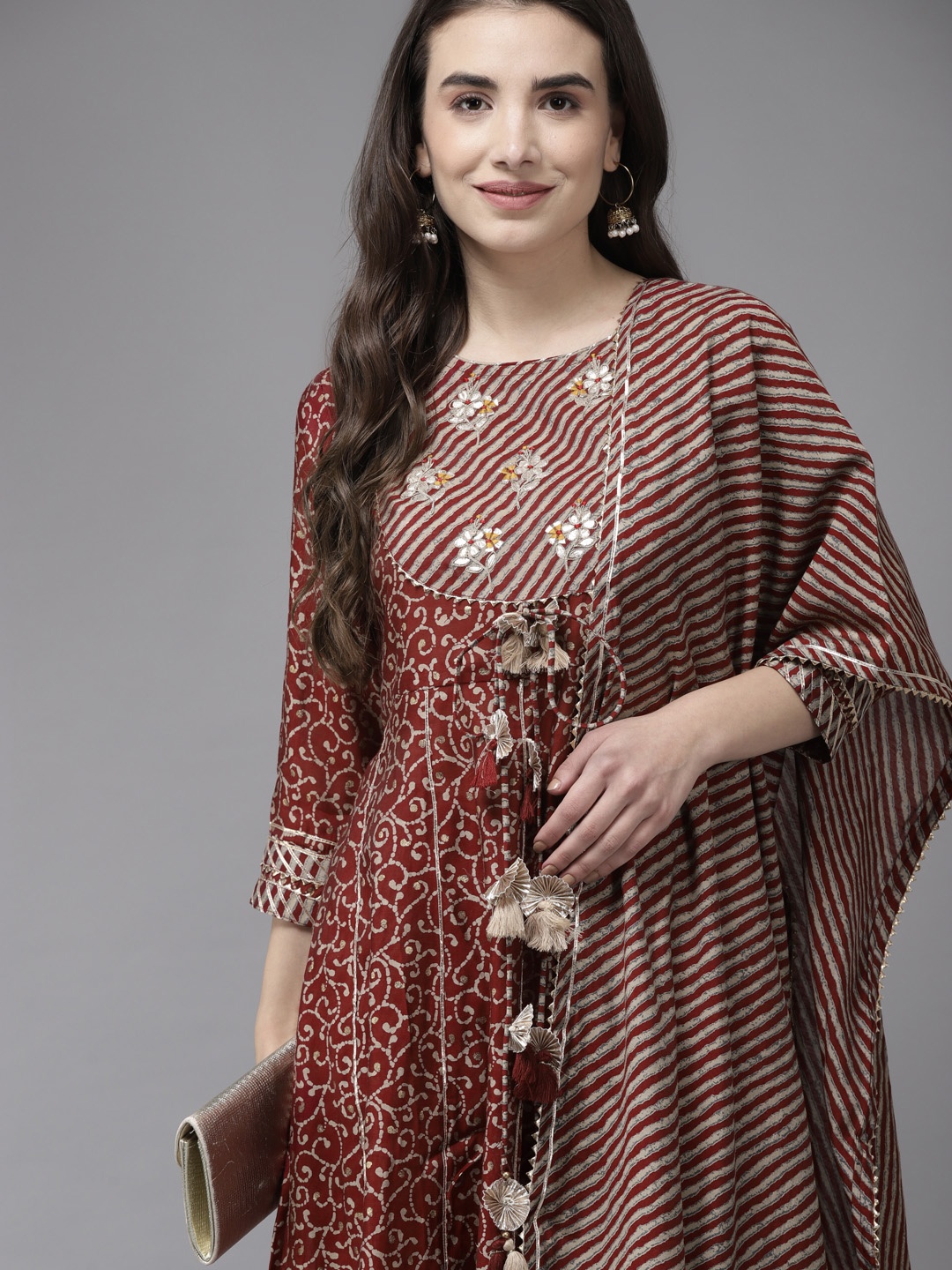 Ishin Women Maroon Leheriya Embroidered Gotta Patti Kurta with Trousers & With Dupatta
Ishin Women Maroon Leheriya Embroidered Gotta Patti Kurta with Trousers & With Dupatta
