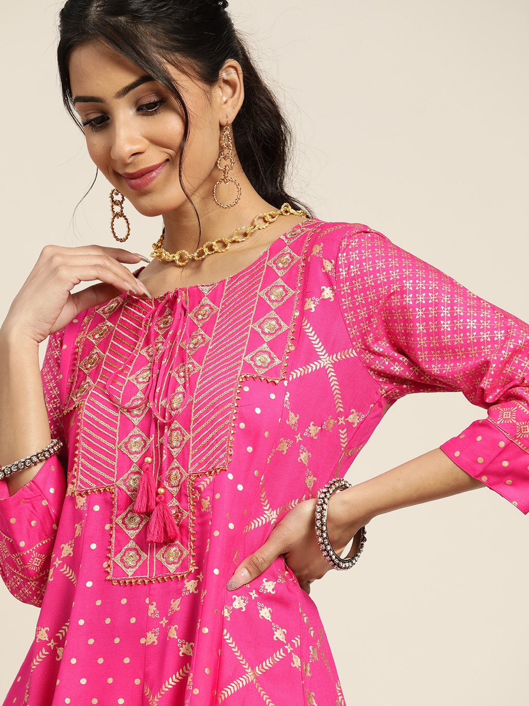 Sangria Women Pink & Golden Ethnic Motifs Printed Yoke Design Kurti with Dhoti Pants
Sangria Women Pink & Golden Ethnic Motifs Printed Yoke Design Kurti with Dhoti Pants