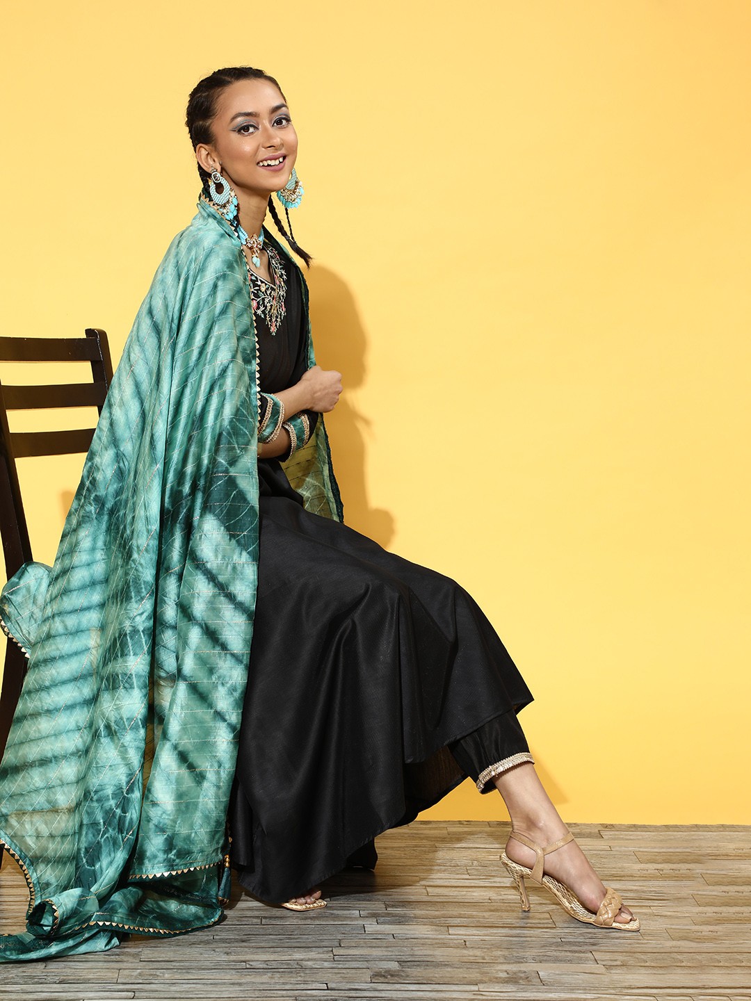 Indo Era Women Black Floral Embroidered Gotta Patti A-Line Kurta with Trousers & Dupatta
Indo Era Women Black Floral Embroidered Gotta Patti A-Line Kurta with Trousers & Dupatta