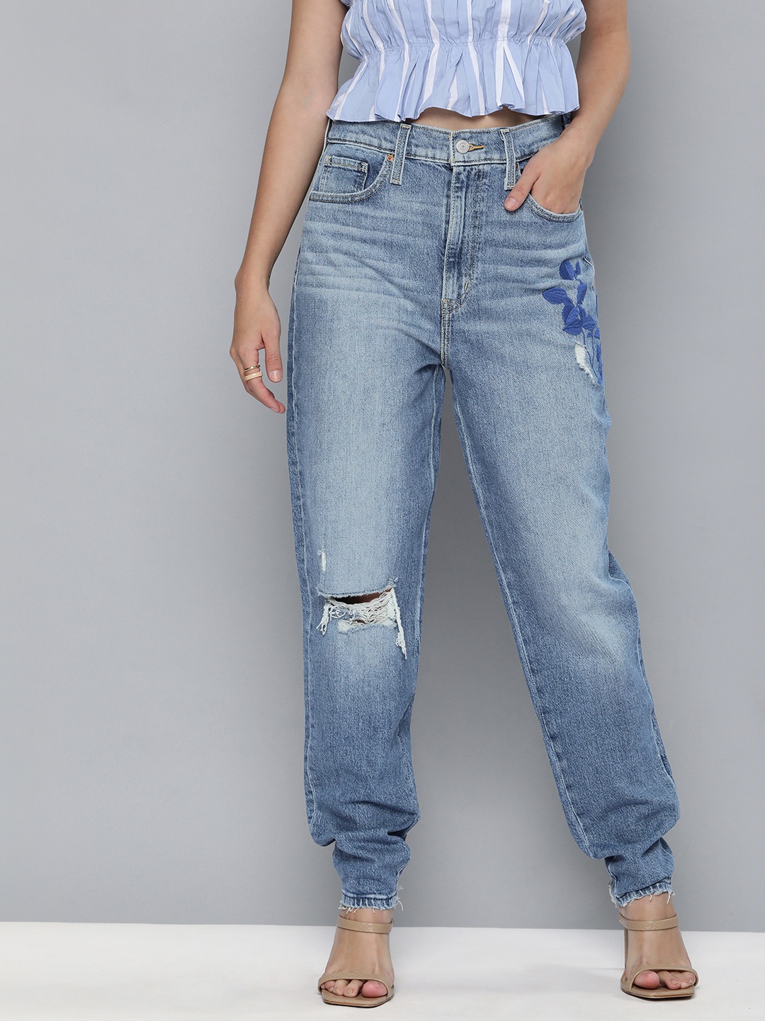 Levis Women Blue Tapered Fit High-Rise Mildly Distressed Light Fade Embroidered Stretchable Jeans
Levis Women Blue Tapered Fit High-Rise Mildly Distressed Light Fade Embroidered Stretchable Jeans