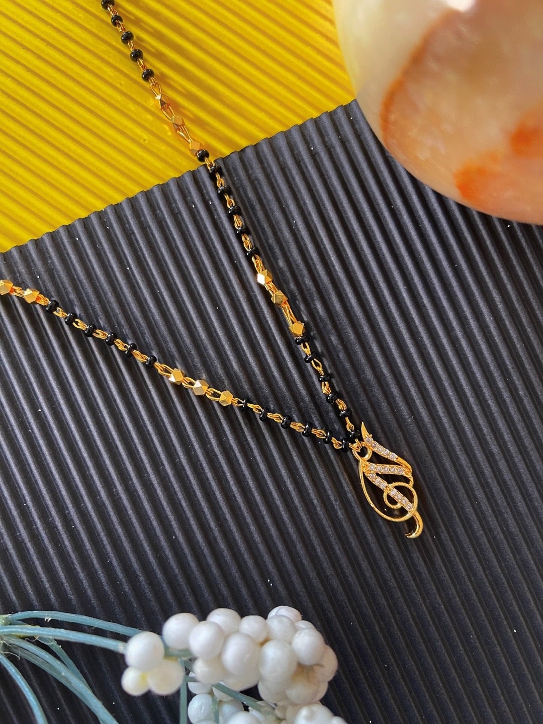 Digital Dress Room Gold-Plated Black & White Stone-Studded & Beaded N-Shaped Mangalsutra
Digital Dress Room Gold-Plated Black & White Stone-Studded & Beaded N-Shaped Mangalsutra