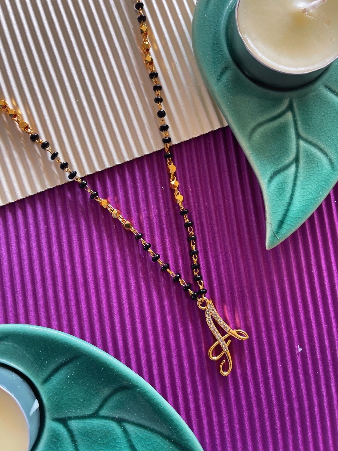 Digital Dress Room Gold-Plated Black & White Stone-Studded & Beaded A-Shaped Mangalsutra
Digital Dress Room Gold-Plated Black & White Stone-Studded & Beaded A-Shaped Mangalsutra