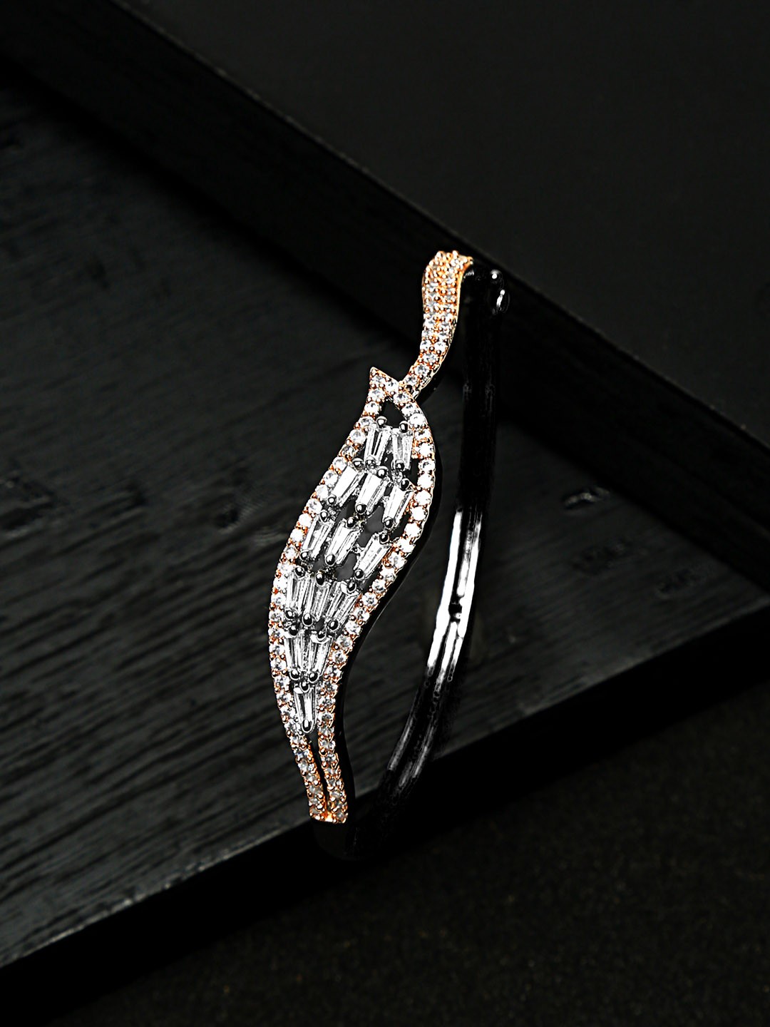 Yellow Chimes Women Silver-Toned & Gold-Toned American Diamond Rhodium-Plated Bangle-Style Bracelet
Yellow Chimes Women Silver-Toned & Gold-Toned American Diamond Rhodium-Plated Bangle-Style Bracelet