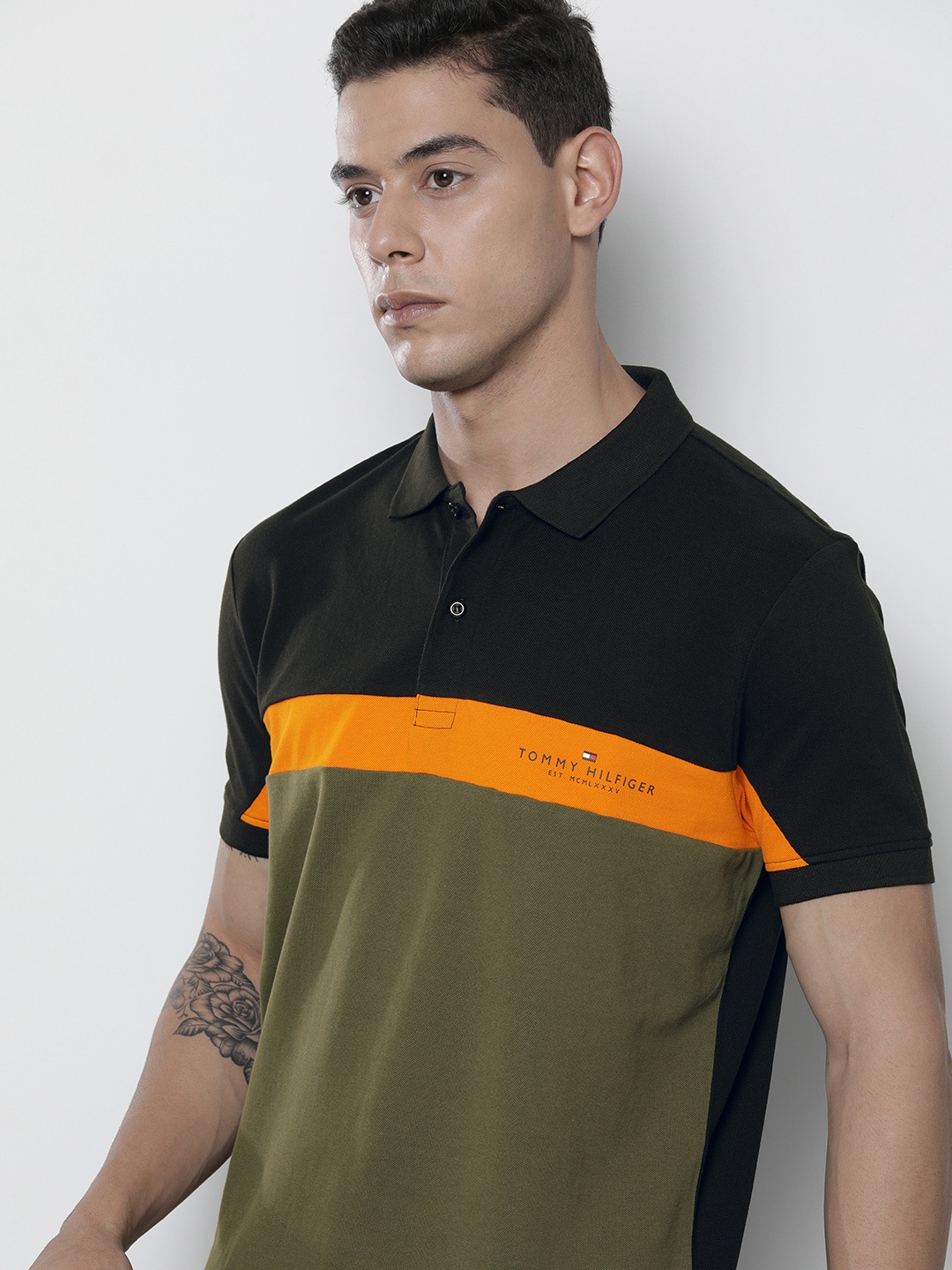 Tommy Hilfiger Men Black & Olive Green Colourblocked Polo Collar Organic Cotton T-shirt
Tommy Hilfiger Men Black & Olive Green Colourblocked Polo Collar Organic Cotton T-shirt