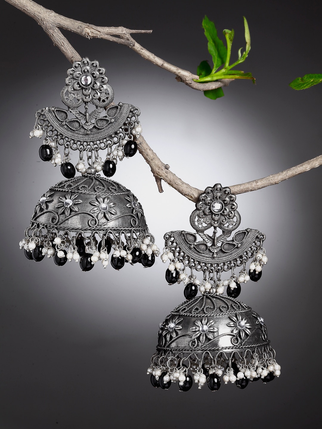 Moedbuille Oxidised Silver-Plated Black & White Pearls Antique Tribal Jhumkas Earrings
Moedbuille Oxidised Silver-Plated Black & White Pearls Antique Tribal Jhumkas Earrings