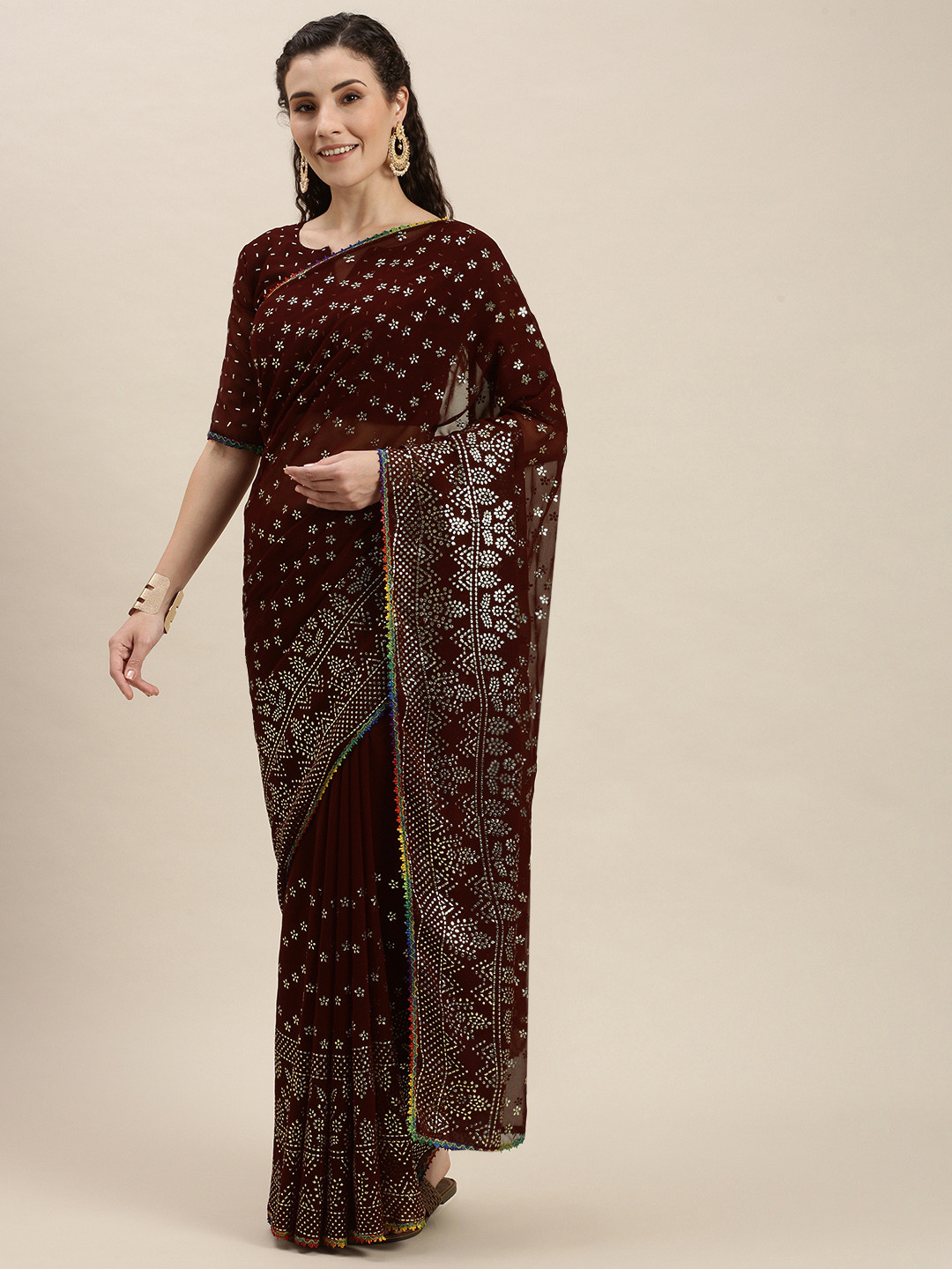 Amrutam Fab Brown & Gold-Toned Beads and Stones Embroidered Pure Georgette Saree 
Amrutam Fab Brown & Gold-Toned Beads and Stones Embroidered Pure Georgette Saree