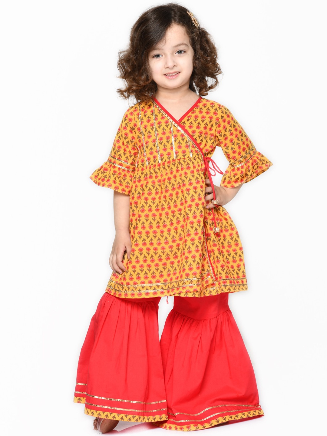 SAKA DESIGNS Girls Orange Ethnic Motifs Printed Angrakha Gotta Patti Pure Cotton Kurti with Sharara
SAKA DESIGNS Girls Orange Ethnic Motifs Printed Angrakha Gotta Patti Pure Cotton Kurti with Sharara