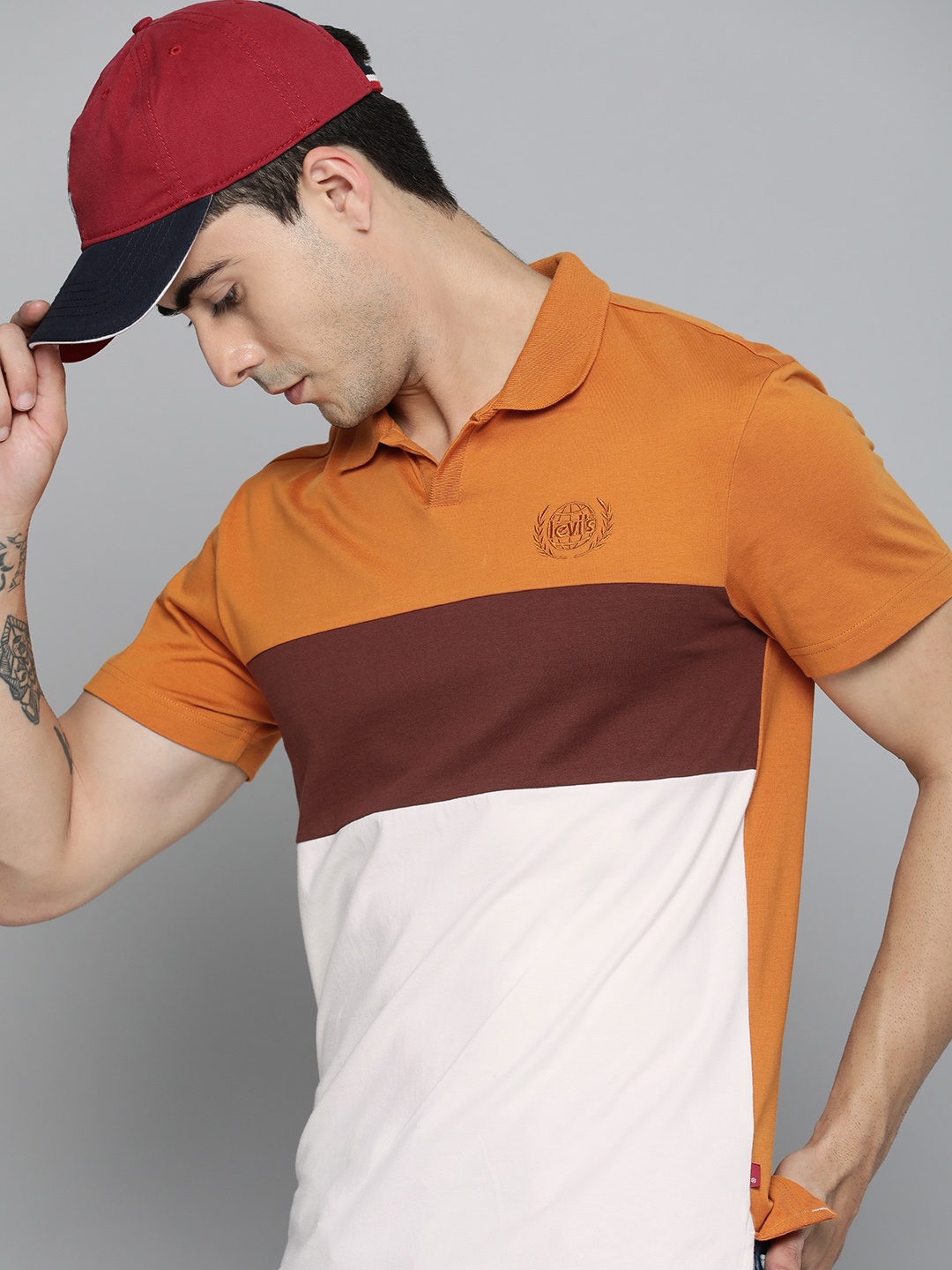Levis Men Rust Brown & White Colourblocked Polo Collar Pure Cotton Embroidered T-shirt
Levis Men Rust Brown & White Colourblocked Polo Collar Pure Cotton Embroidered T-shirt