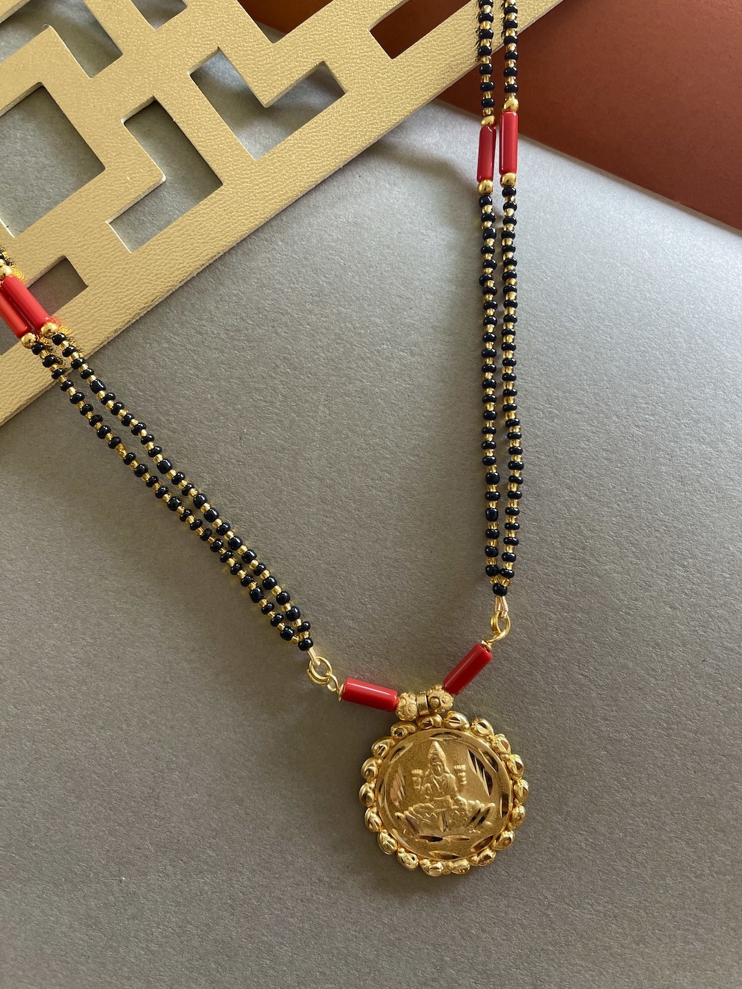 Digital Dress Room Gold-Plated Black & Red Beaded Laxmi Coin Pendant Long Mangalsutra
Digital Dress Room Gold-Plated Black & Red Beaded Laxmi Coin Pendant Long Mangalsutra