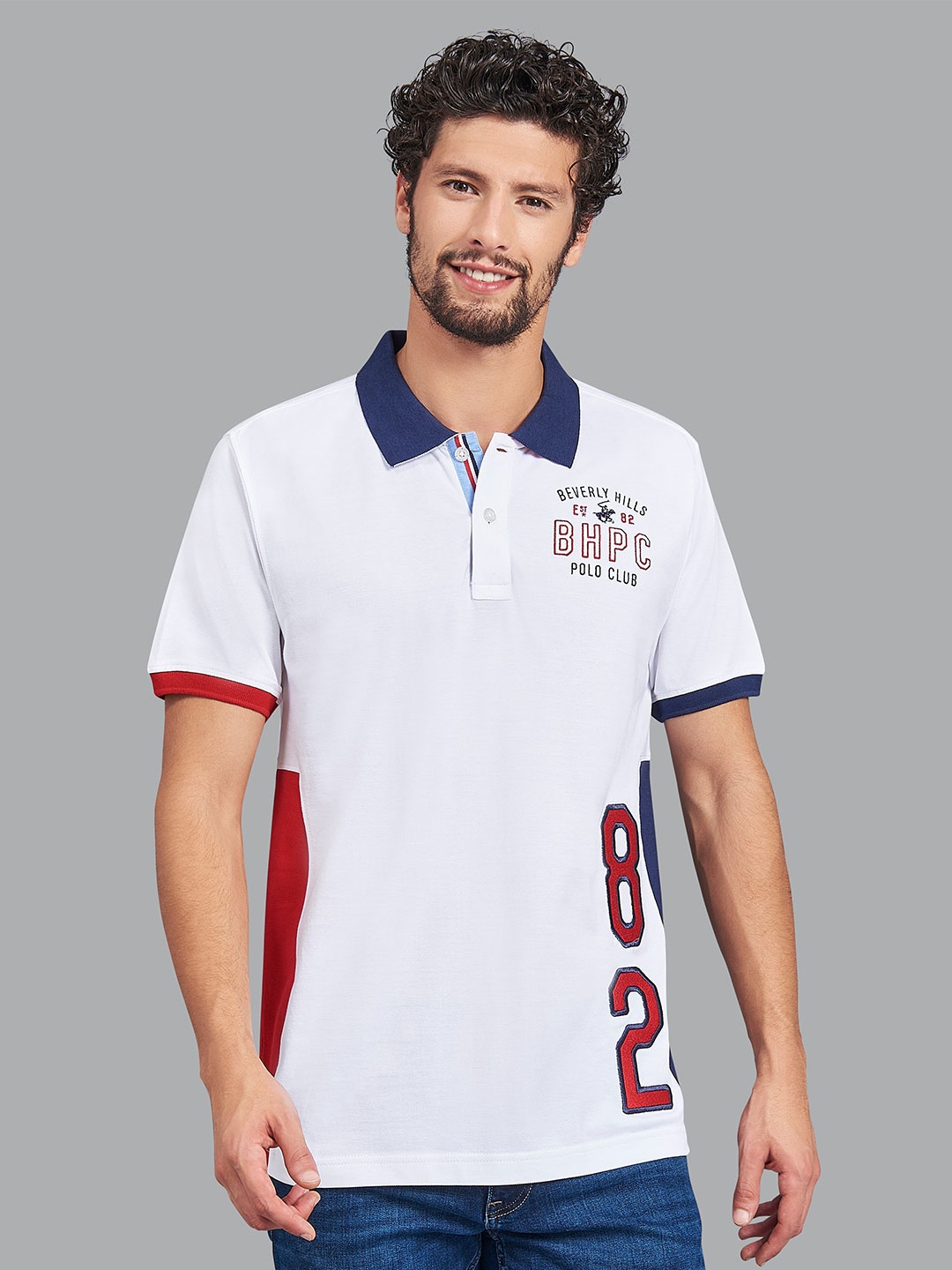 Beverly Hills Polo Club Men White & Blue Varsity Colourblocked Polo Collar T-shirt
Beverly Hills Polo Club Men White & Blue Varsity Colourblocked Polo Collar T-shirt