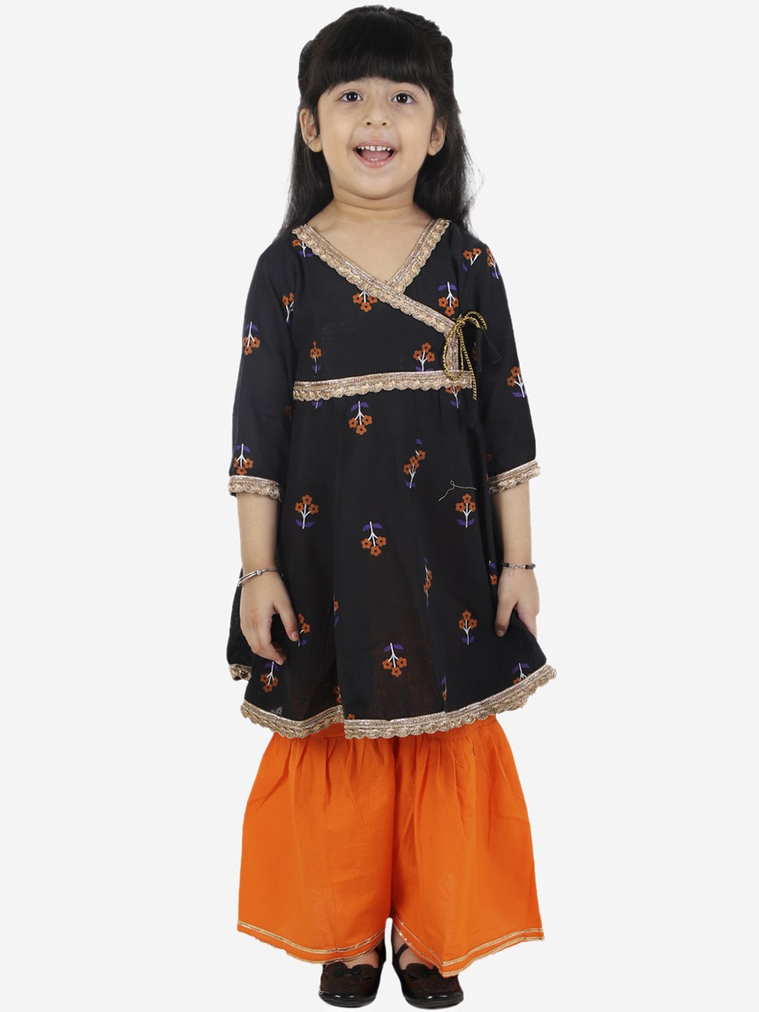 ahhaaaa Girls Black & Orange Ethnic Motifs Printed Angrakha Pure Cotton Kurta with Sharara
ahhaaaa Girls Black & Orange Ethnic Motifs Printed Angrakha Pure Cotton Kurta with Sharara