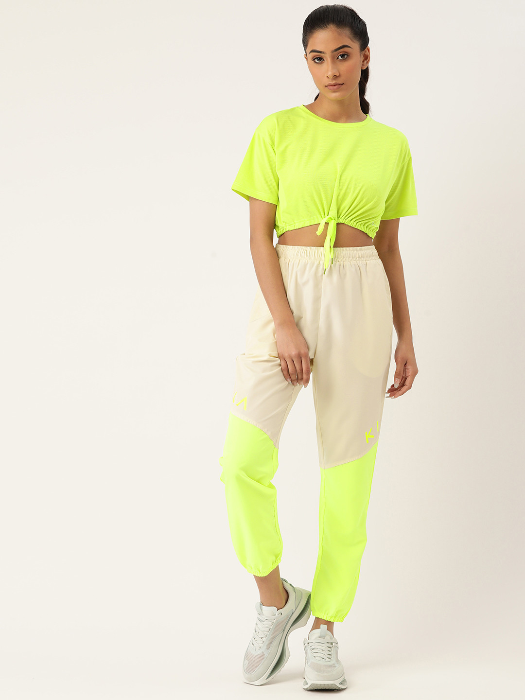 KICA Women Beige & Fluorescent Green Mesh Top & Lightweight Tracks 
KICA Women Beige & Fluorescent Green Mesh Top & Lightweight Tracks