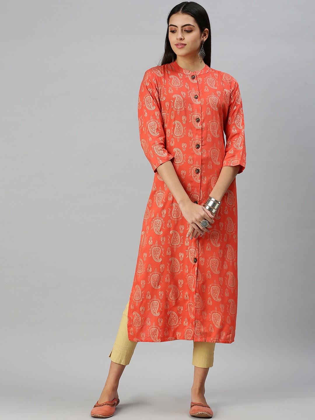 SHOWOFF Women Peach-Coloured & Gold-Toned Ethnic Motifs Printed Cotton Kurta
SHOWOFF Women Peach-Coloured & Gold-Toned Ethnic Motifs Printed Cotton Kurta
