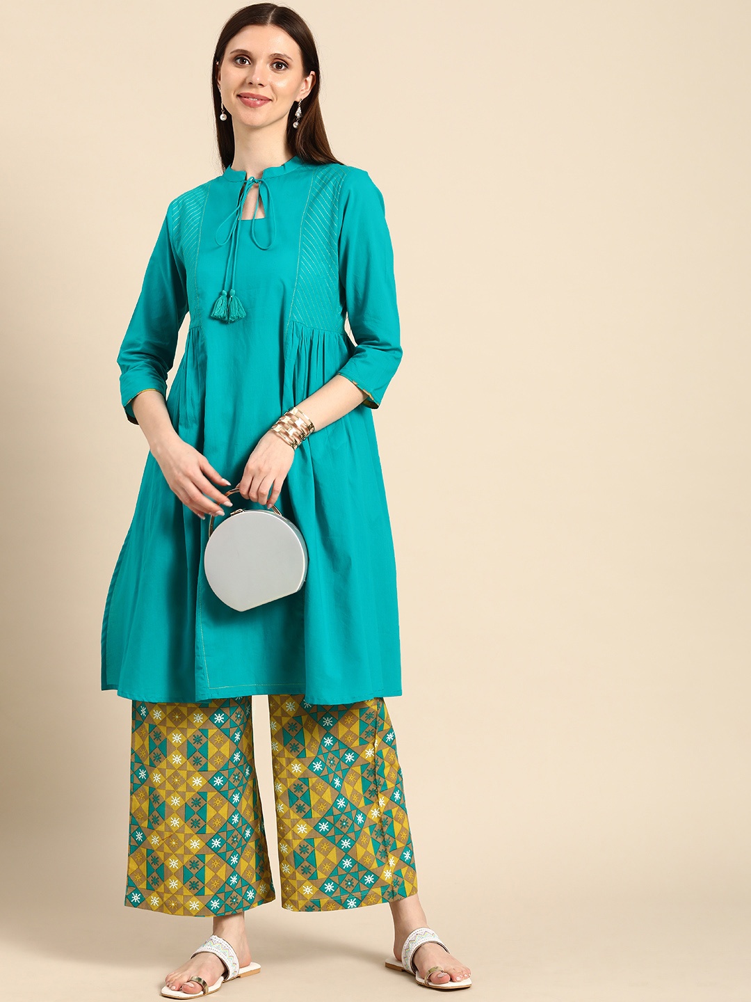 Anouk Women Teal Green Solid Pleated Thread Work Pure Cotton Kurta with Printed Palazzos
Anouk Women Teal Green Solid Pleated Thread Work Pure Cotton Kurta with Printed Palazzos